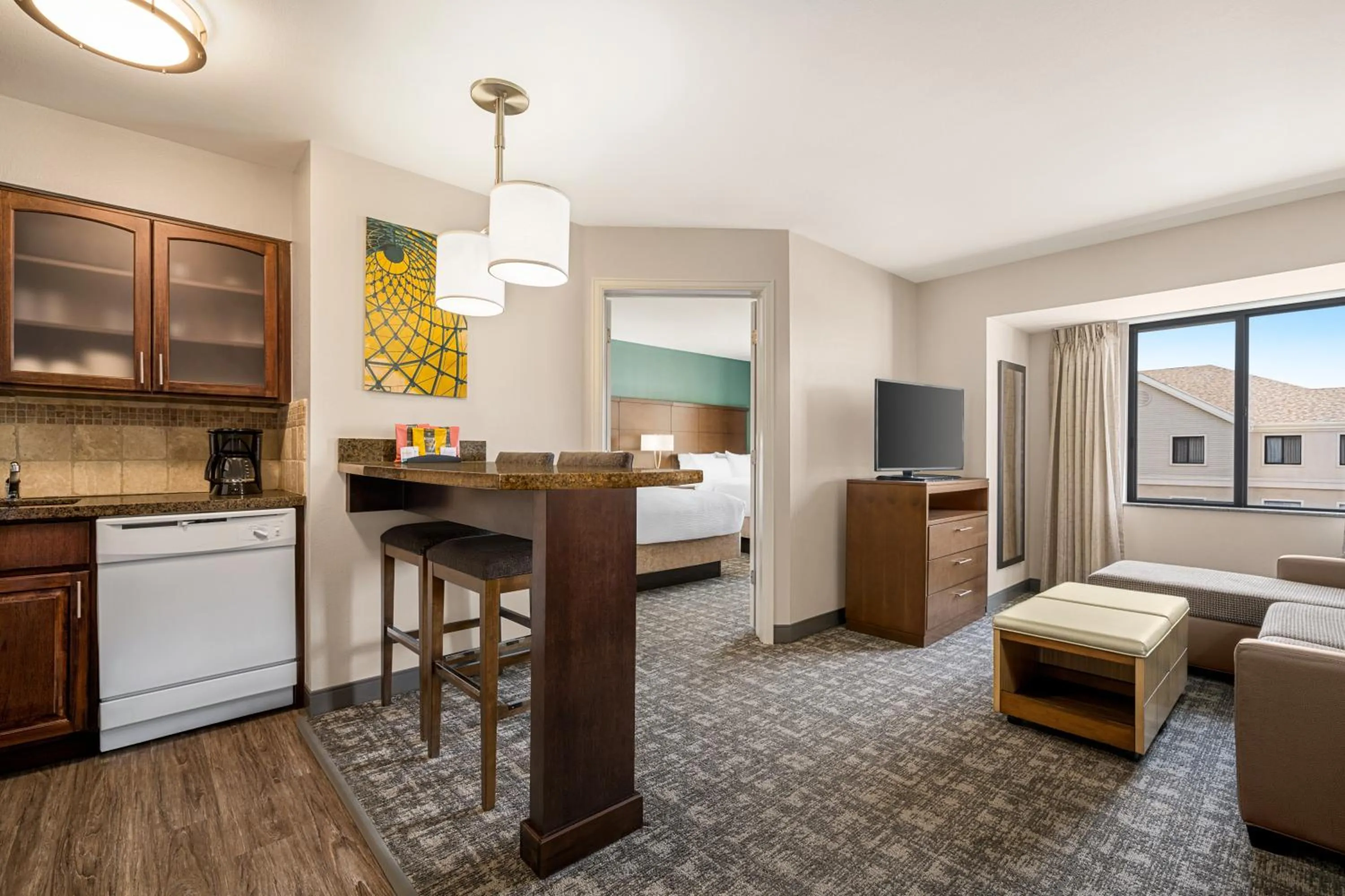 kitchen, Bed in Staybridge Suites Oklahoma City-Quail Springs by IHG