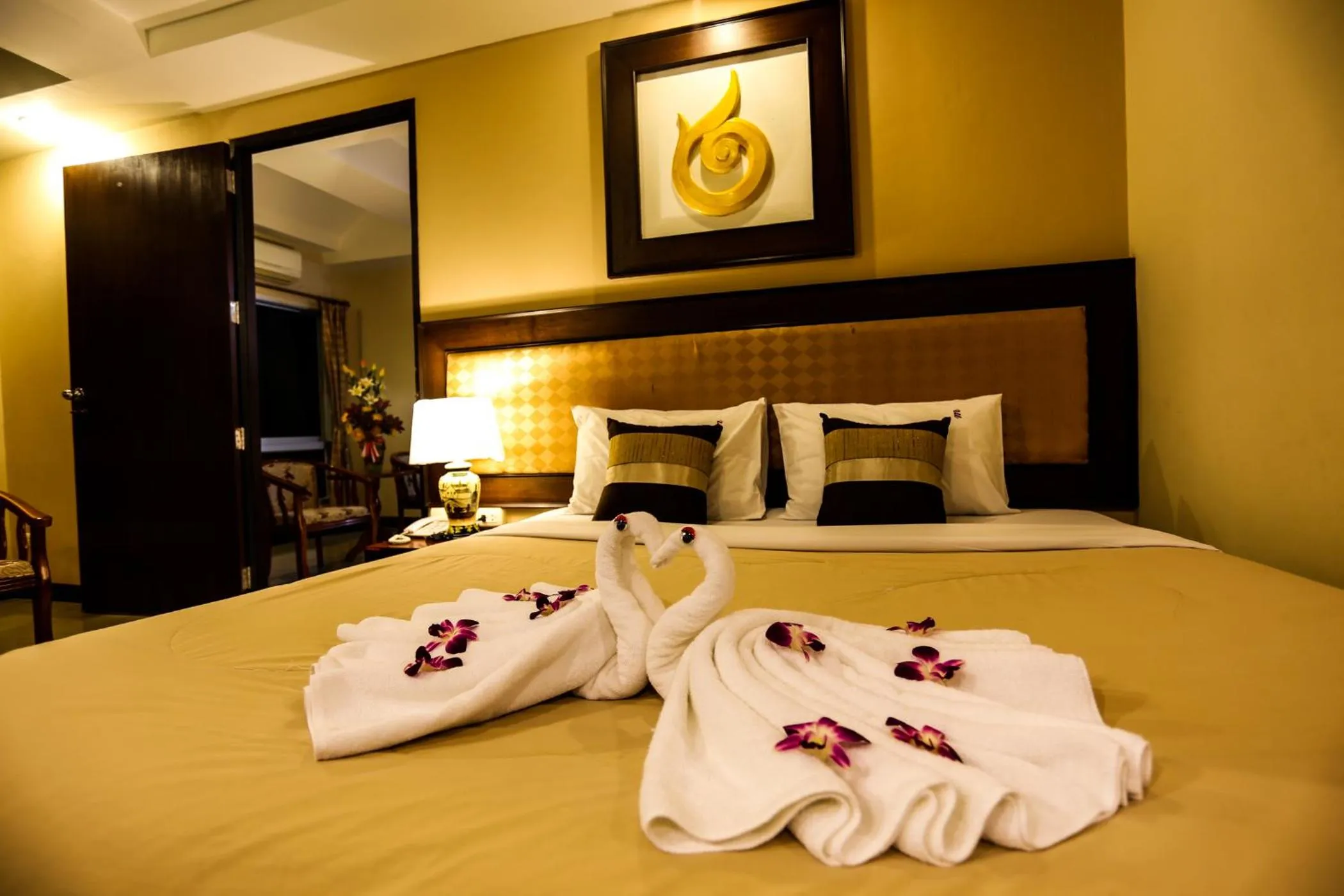 Bed in Madina Rayong Hotel