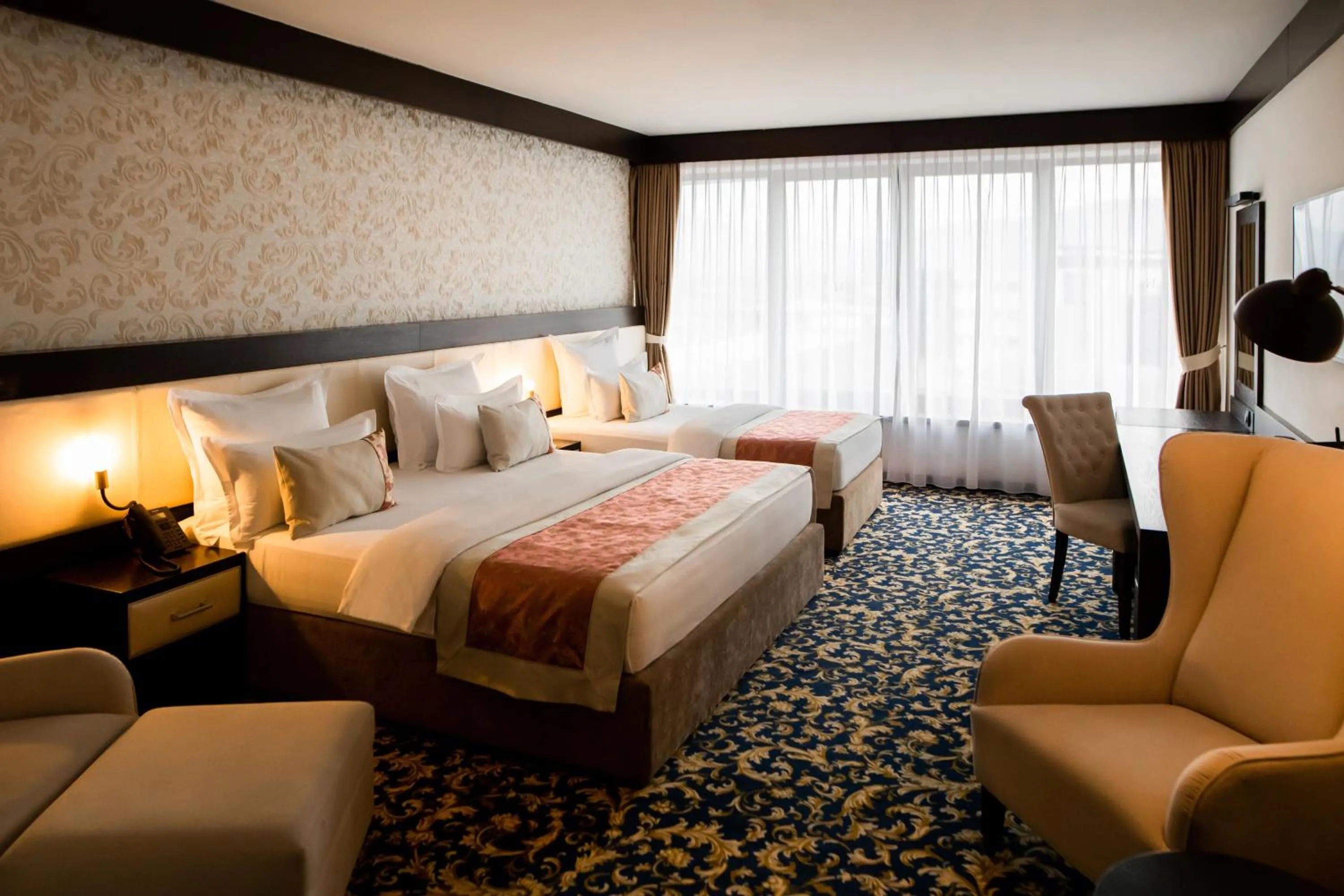 Bed in Malak Regency Hotel