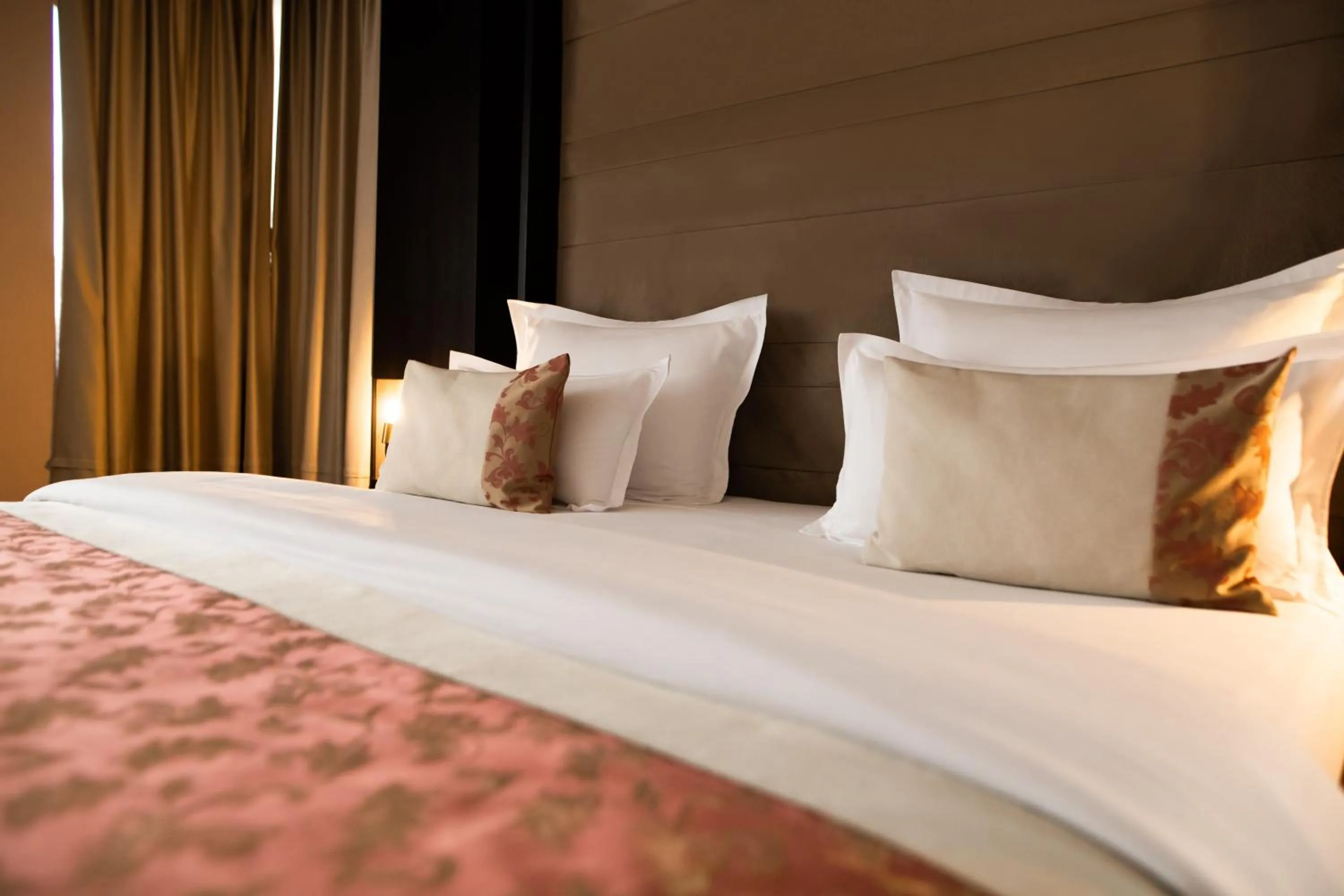 Bed in Malak Regency Hotel