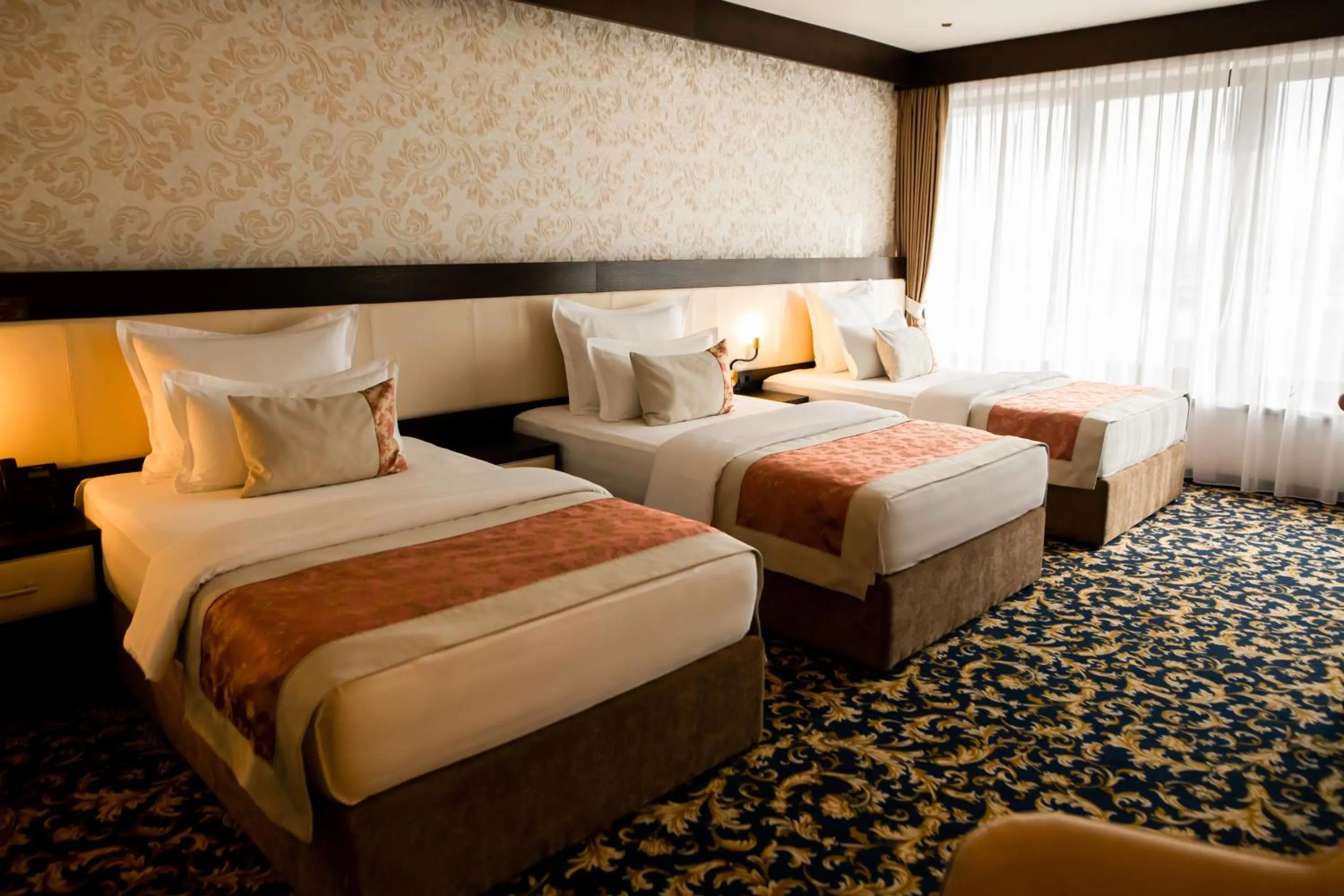 Bed in Malak Regency Hotel