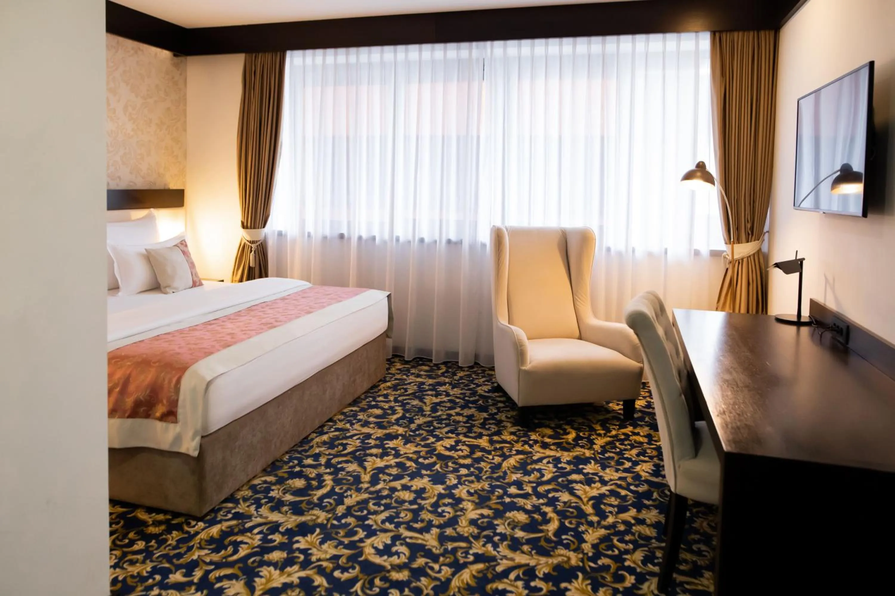 Bed in Malak Regency Hotel
