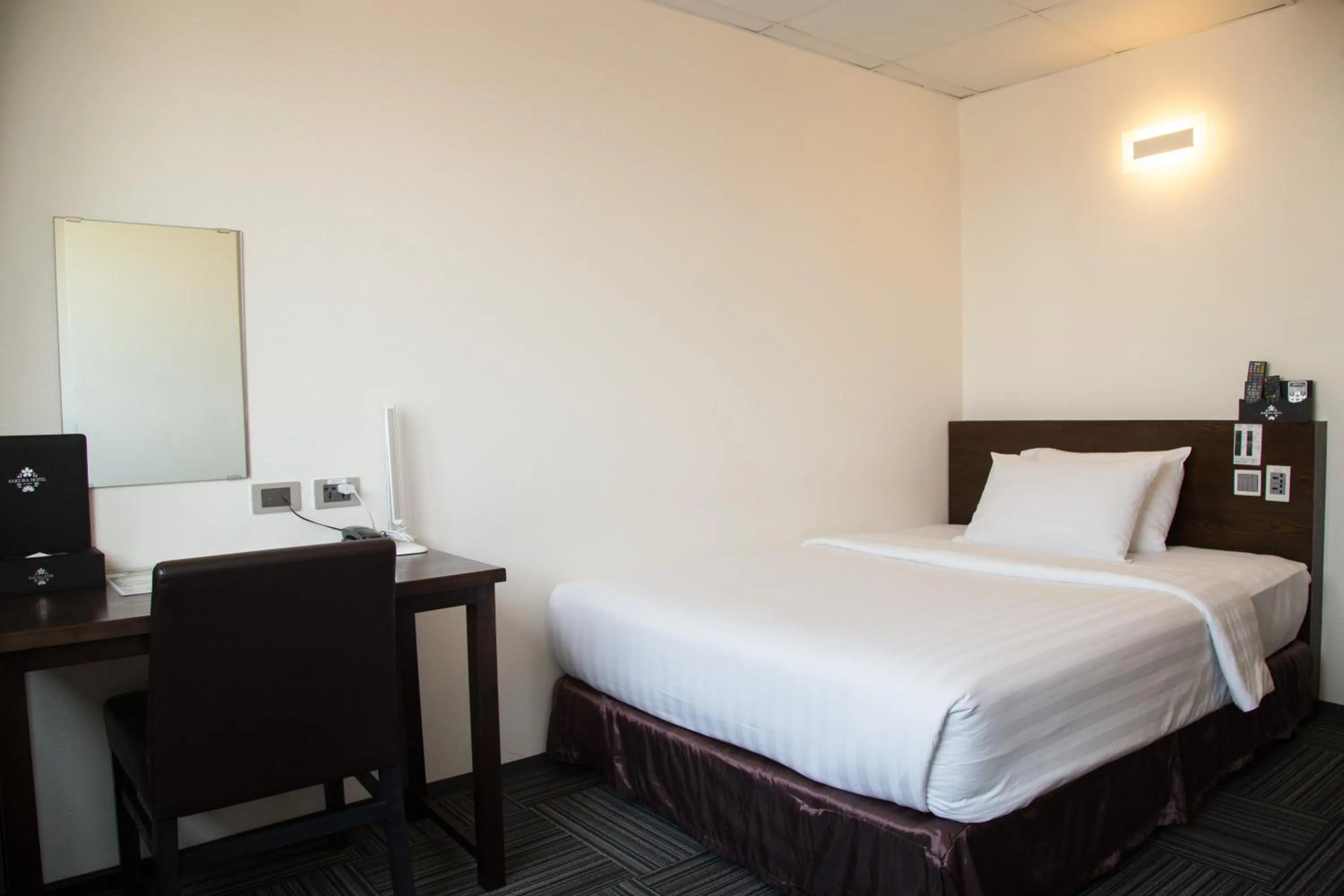 Bed in Sakura Hotel 3