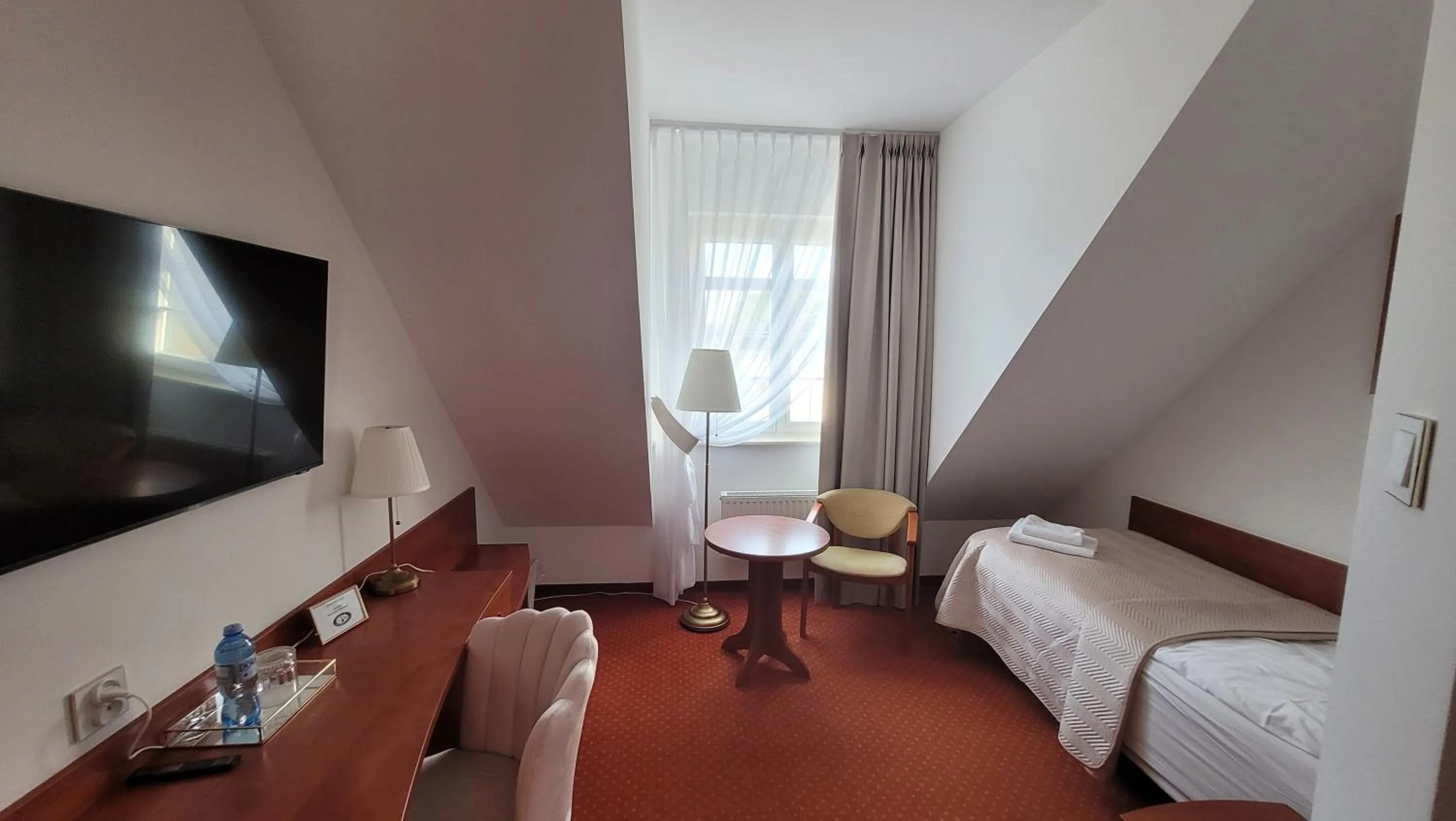 Bed in Hotel Maxim Kwidzyn