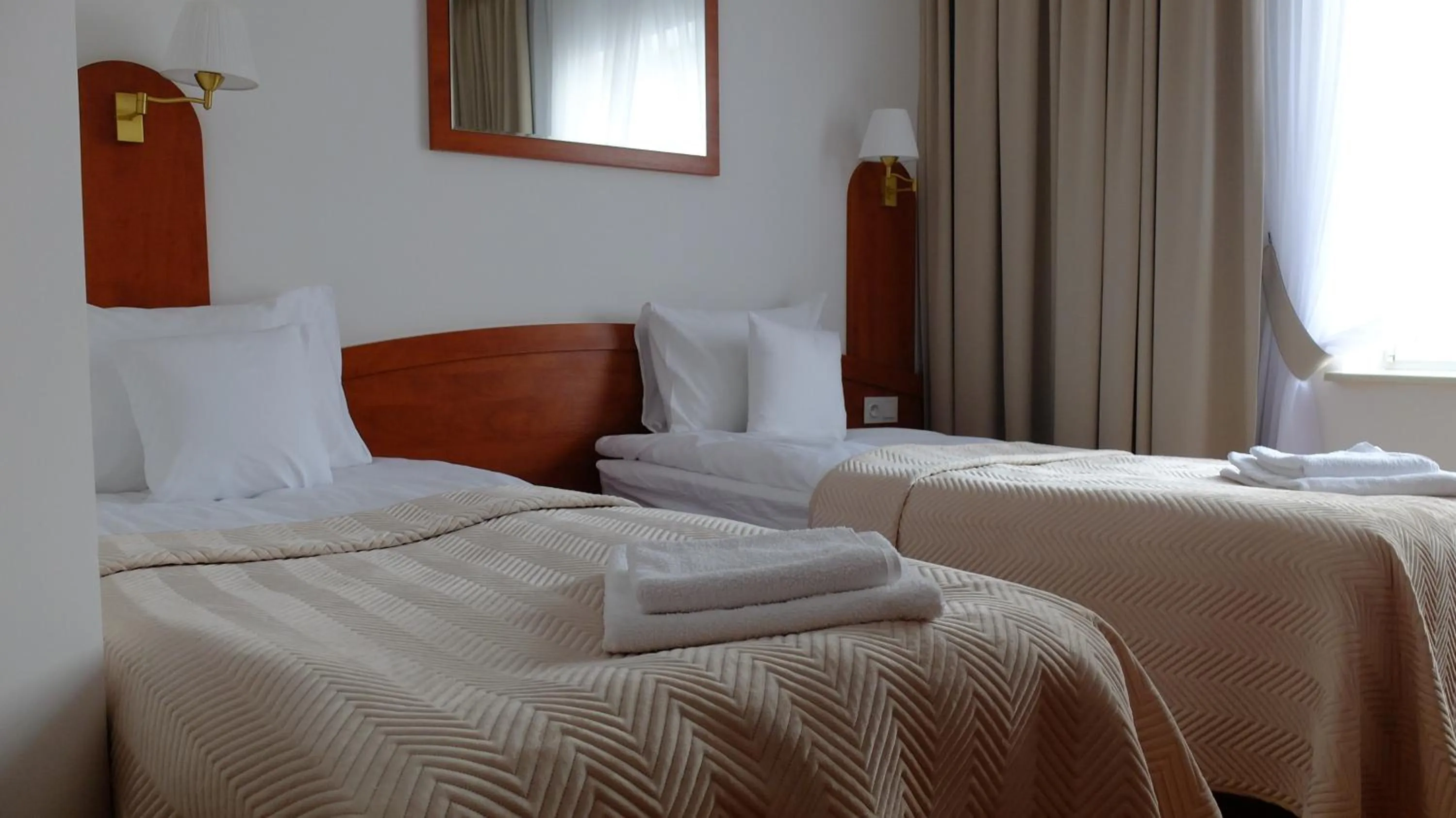 Bed in Hotel Maxim Kwidzyn