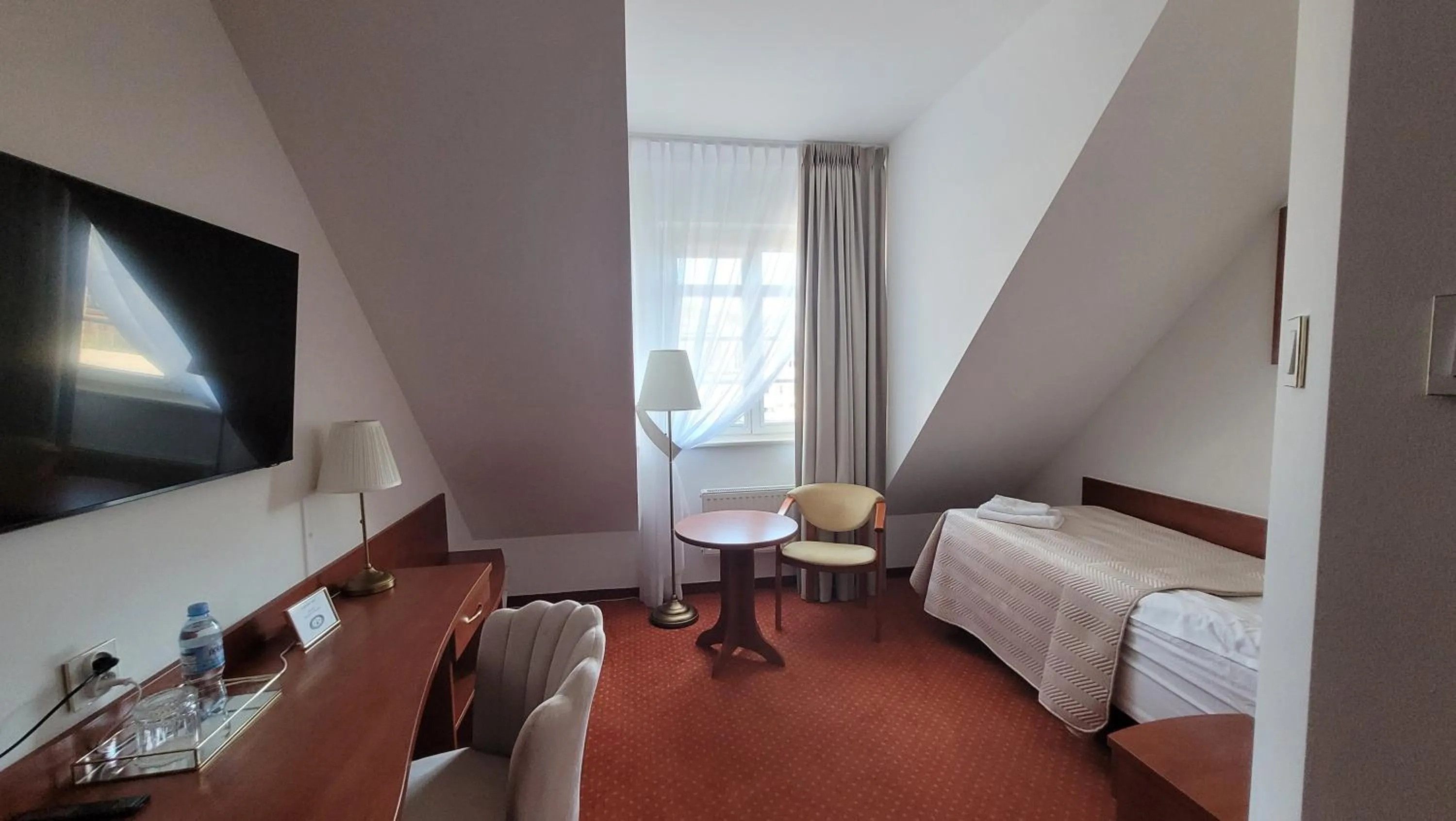 Bed in Hotel Maxim Kwidzyn