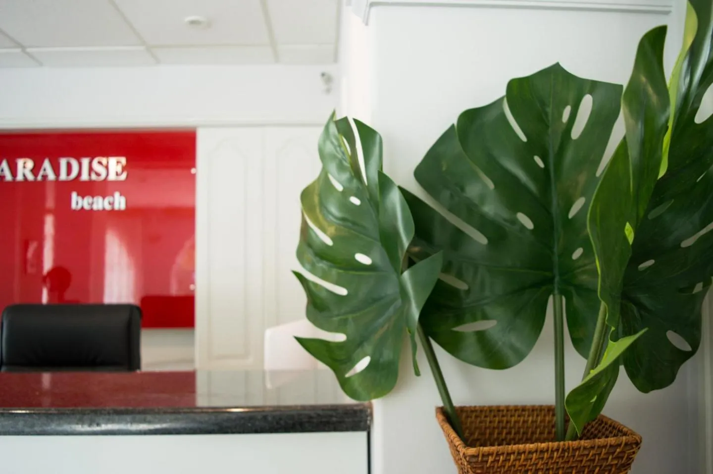 Property logo or sign in Paradise Beach Hotel