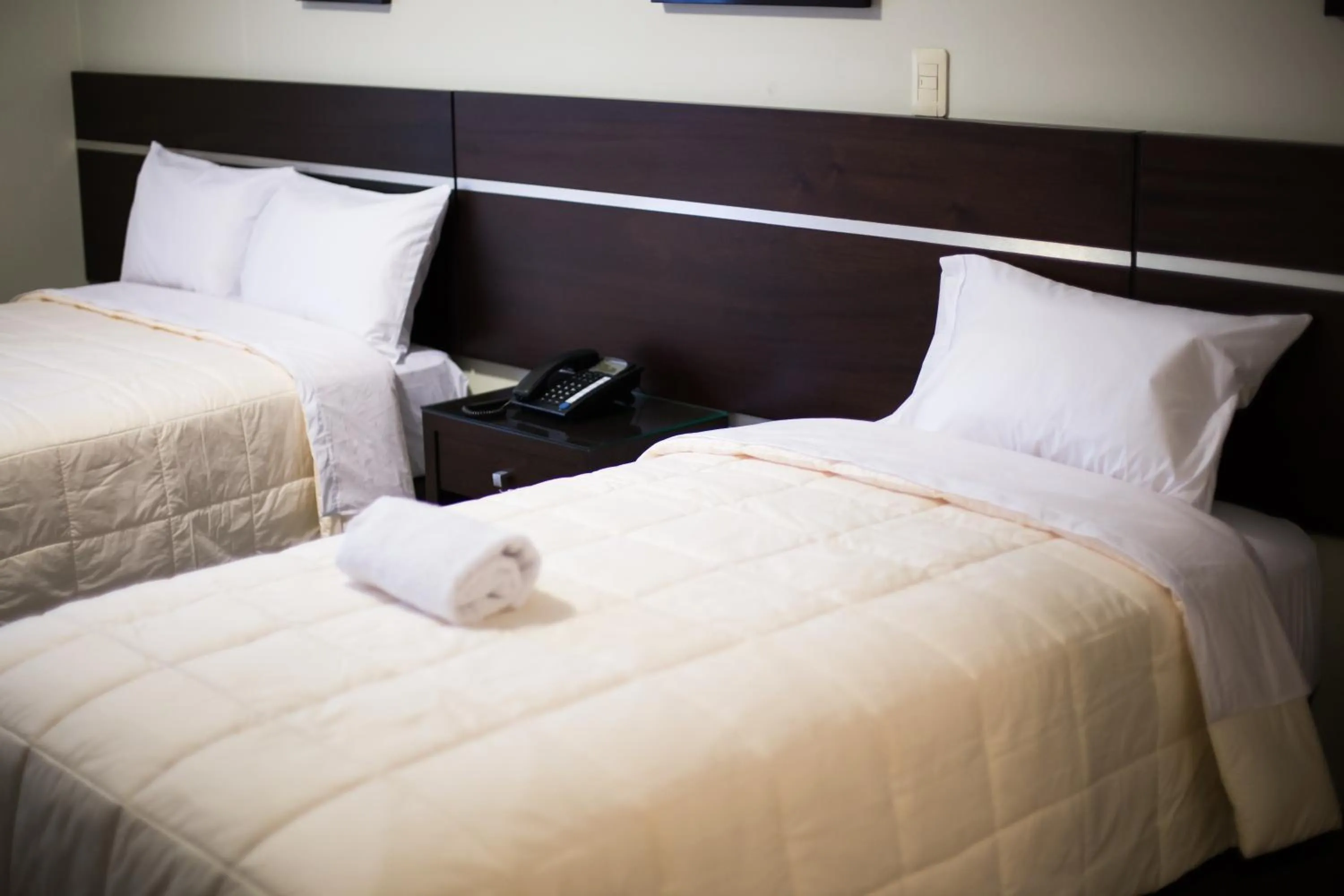 Bed in Mariategui Hotel & Suites