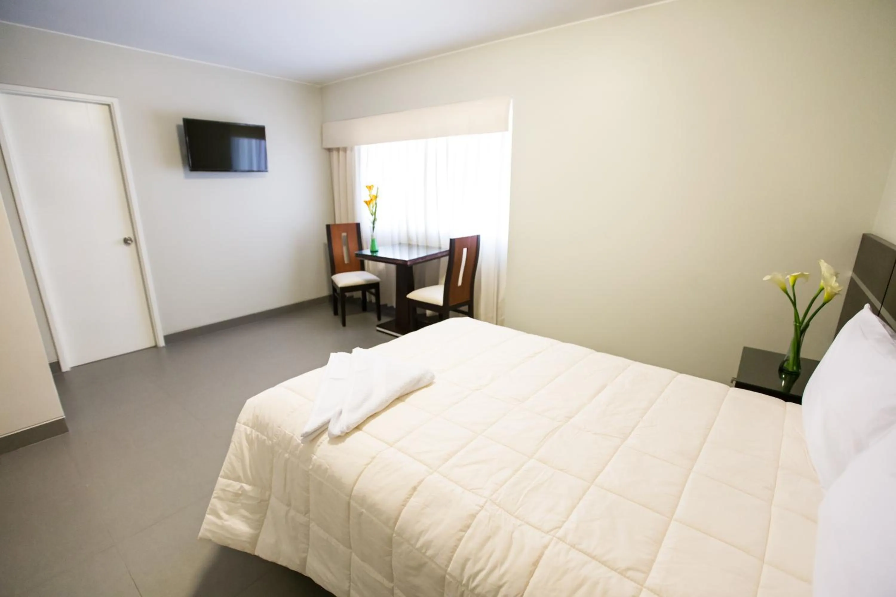 Bed in Mariategui Hotel & Suites