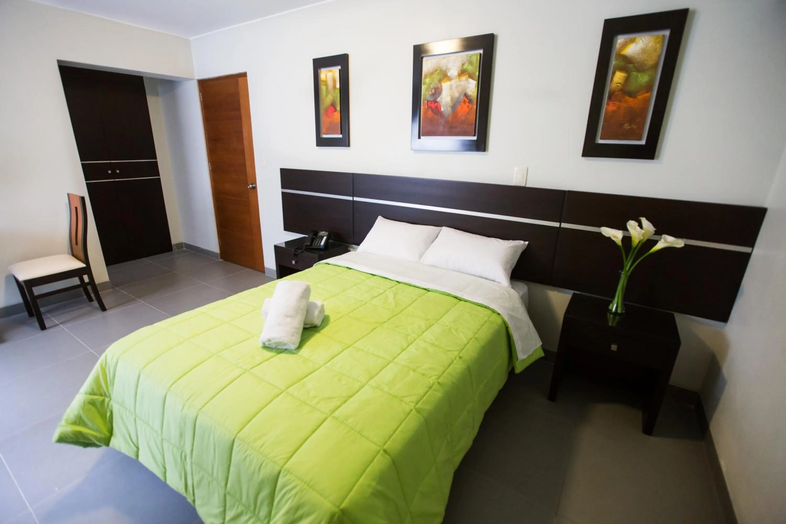 Bed in Mariategui Hotel & Suites