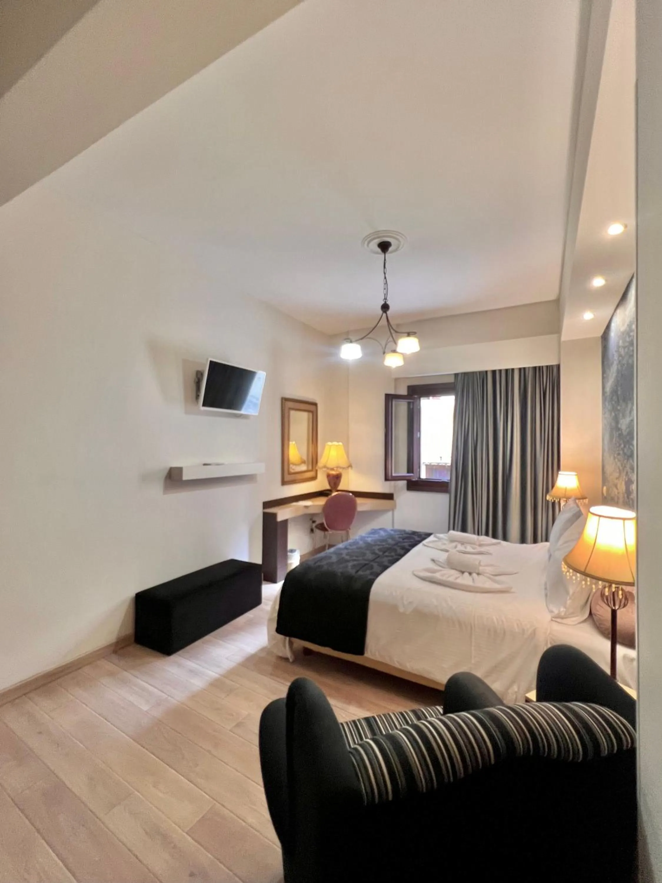 Communal lounge/ TV room, Bed in Pension Dafni