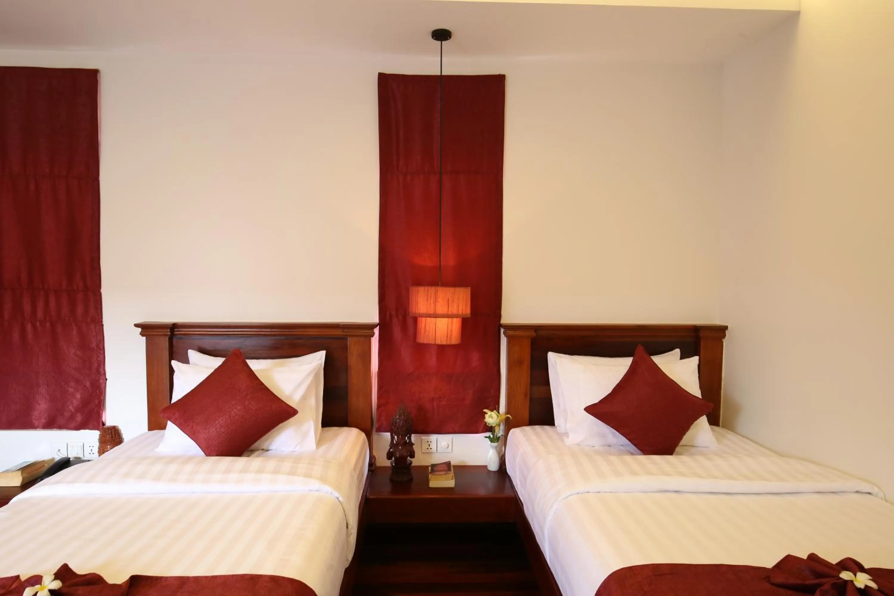 Bed in Holy Angkor Hotel