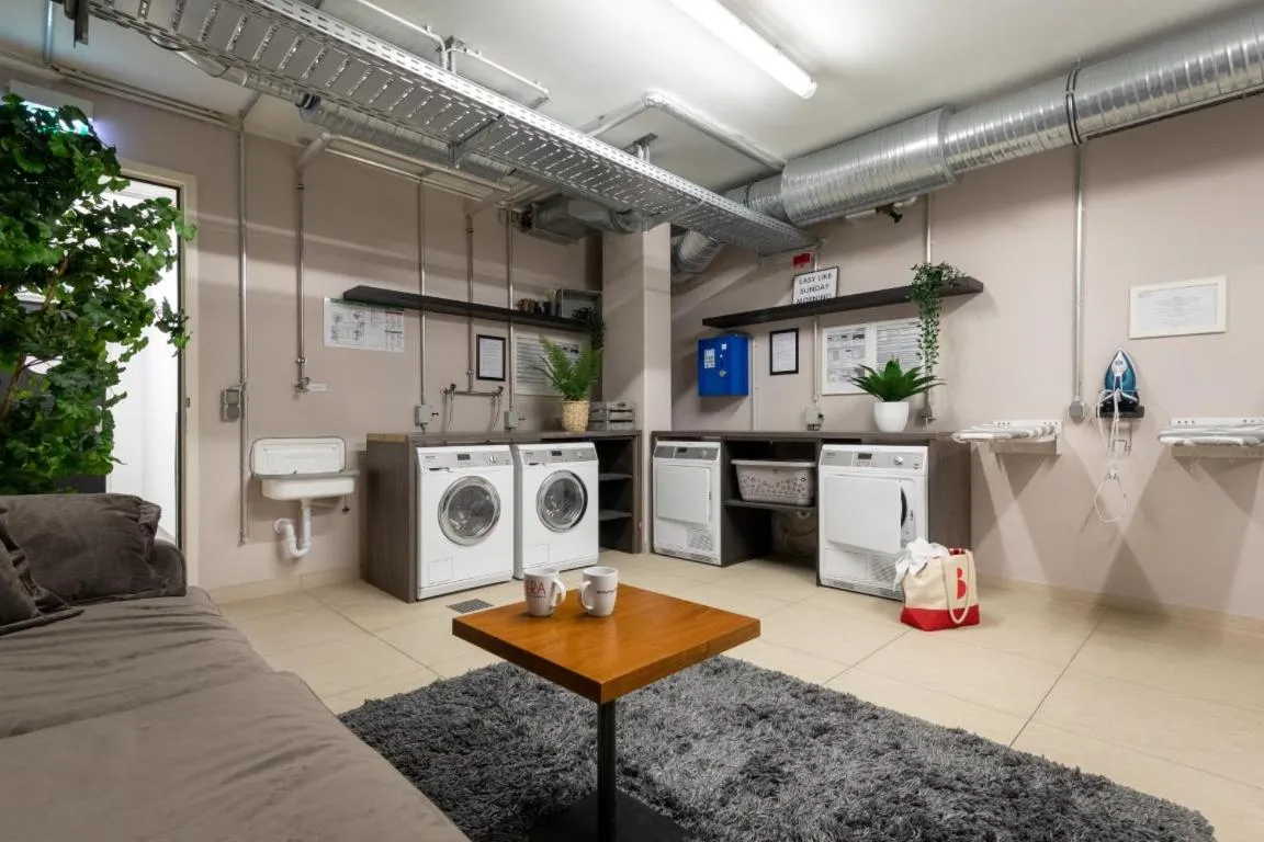 washing machine in Brera Serviced Apartments Munich Schwabing