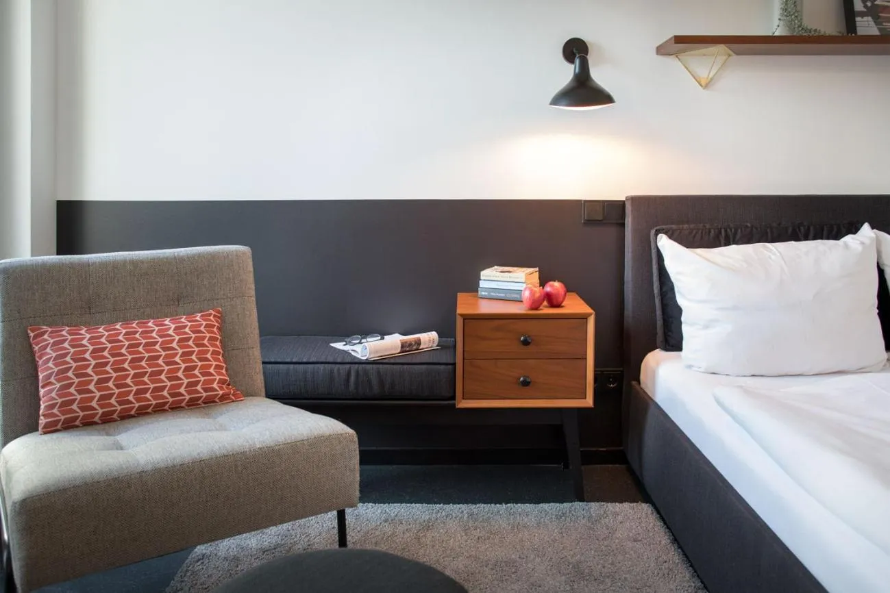 Seating area, Bed in Brera Serviced Apartments Munich Schwabing