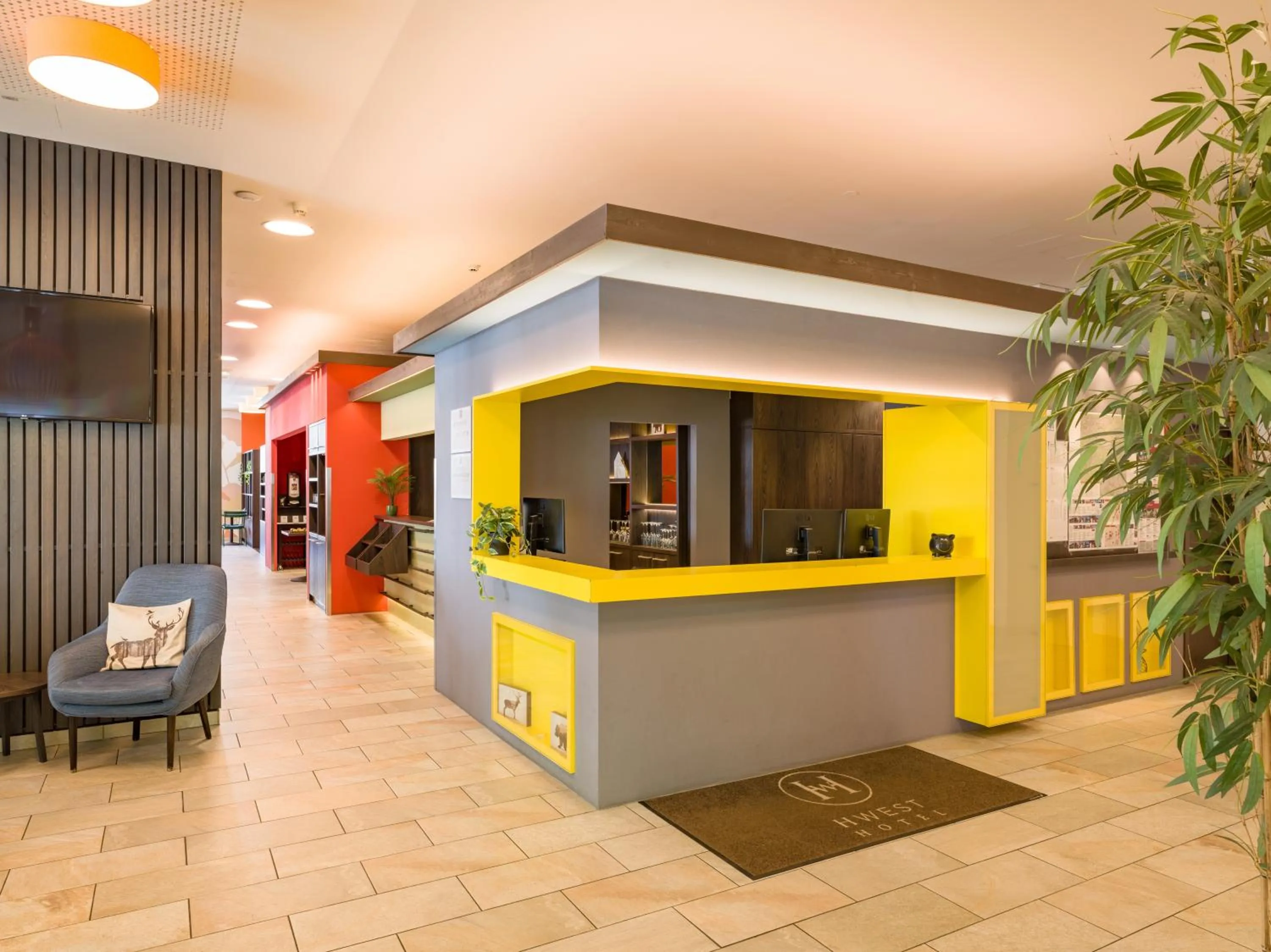 Lobby or reception in Hwest Hotel