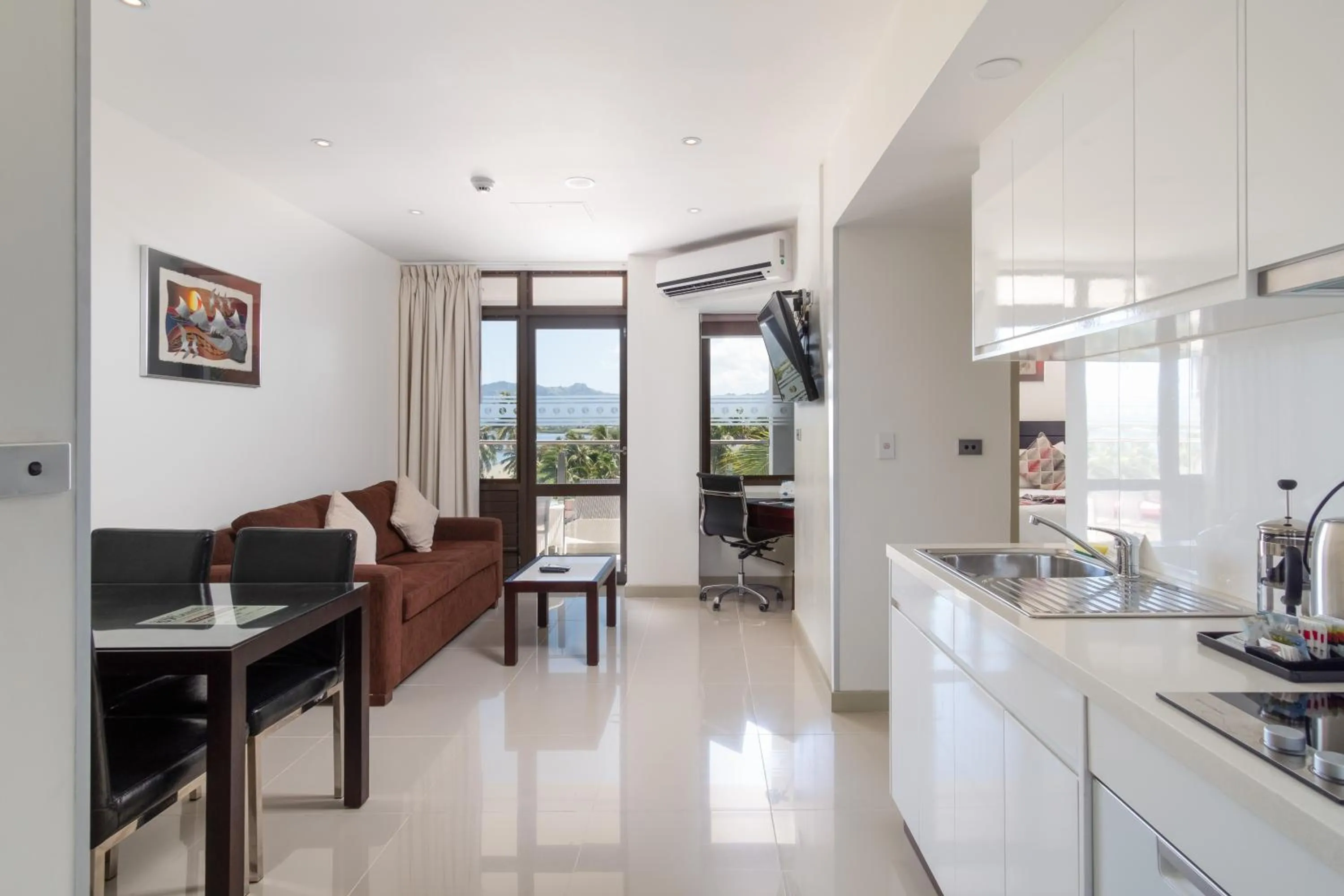 Kitchen or kitchenette in Ramada Suites by Wyndham Wailoaloa Beach Fiji