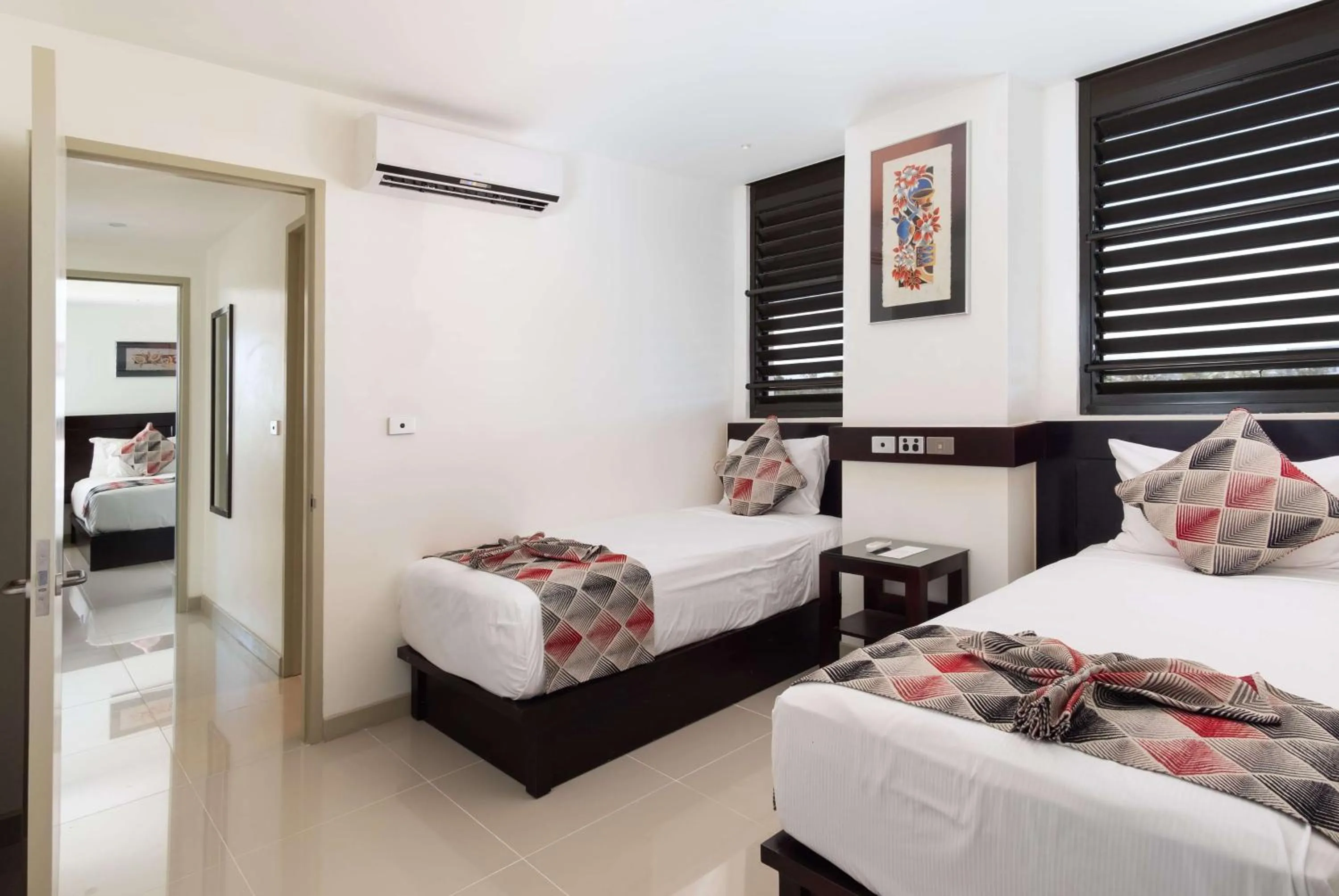 Photo of the whole room, Bed in Ramada Suites by Wyndham Wailoaloa Beach Fiji