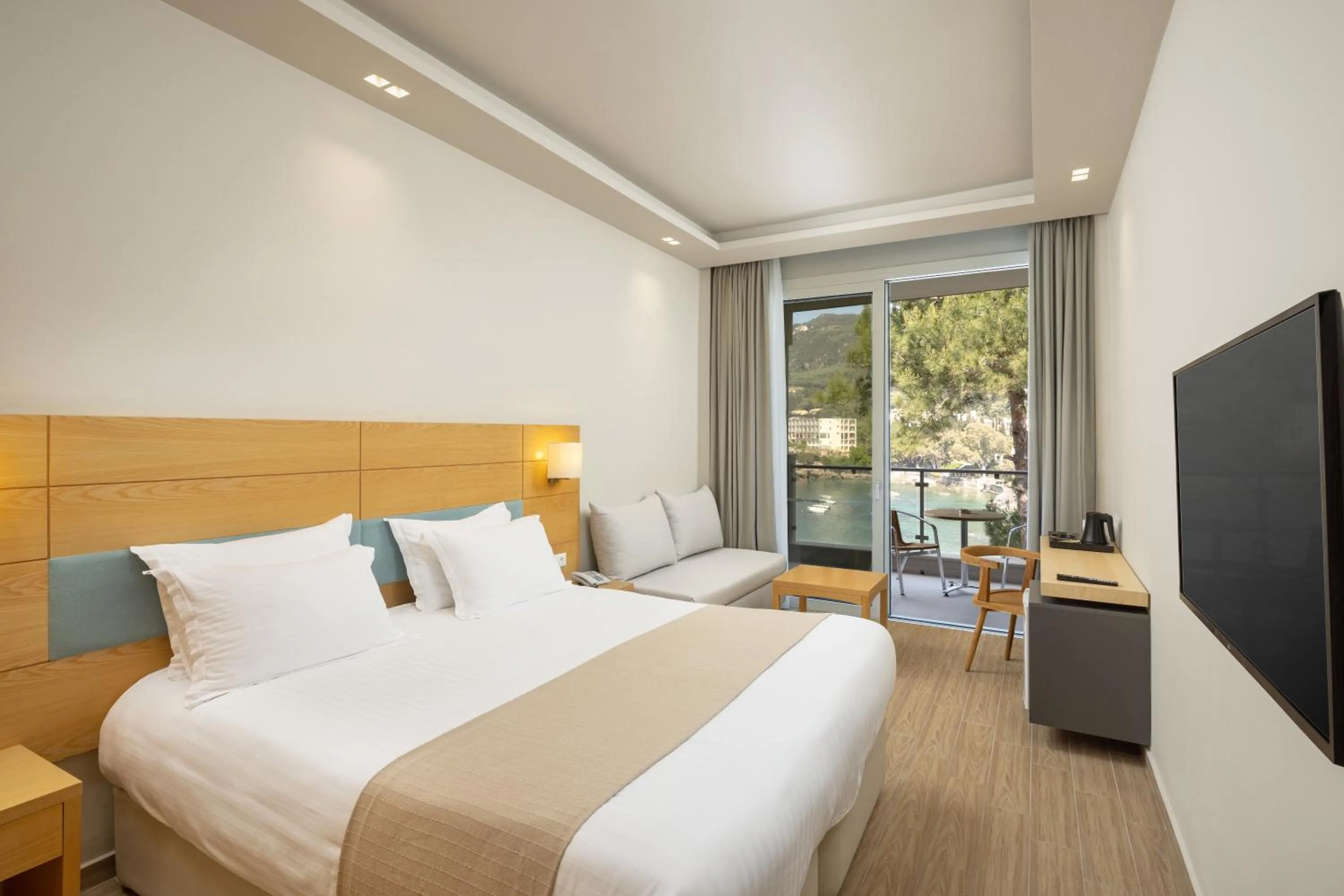 Bedroom, Bed in Akrotiri Beach Resort & Spa - Adult Friendly