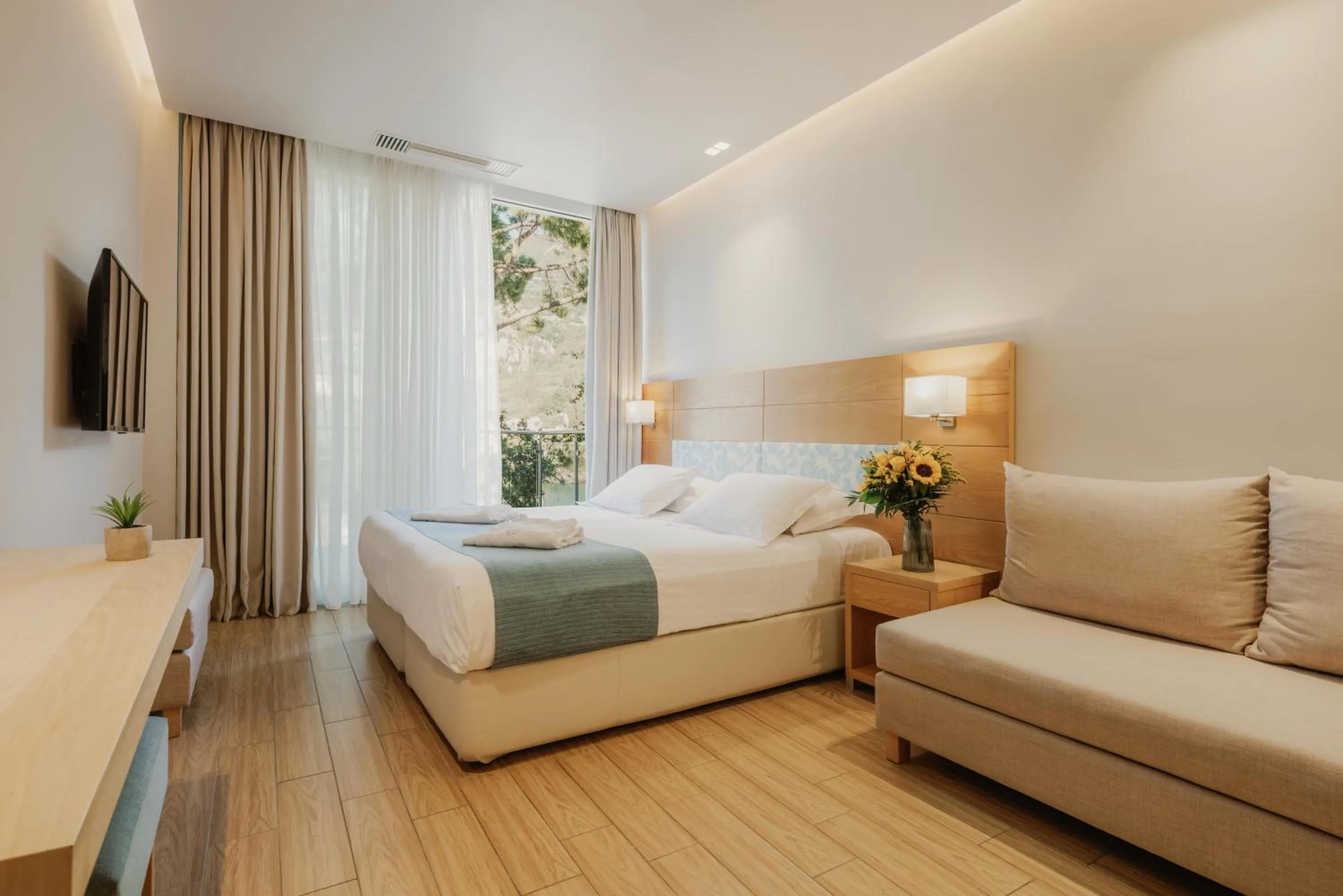 Bedroom, Bed in Akrotiri Beach Resort & Spa - Adult Friendly