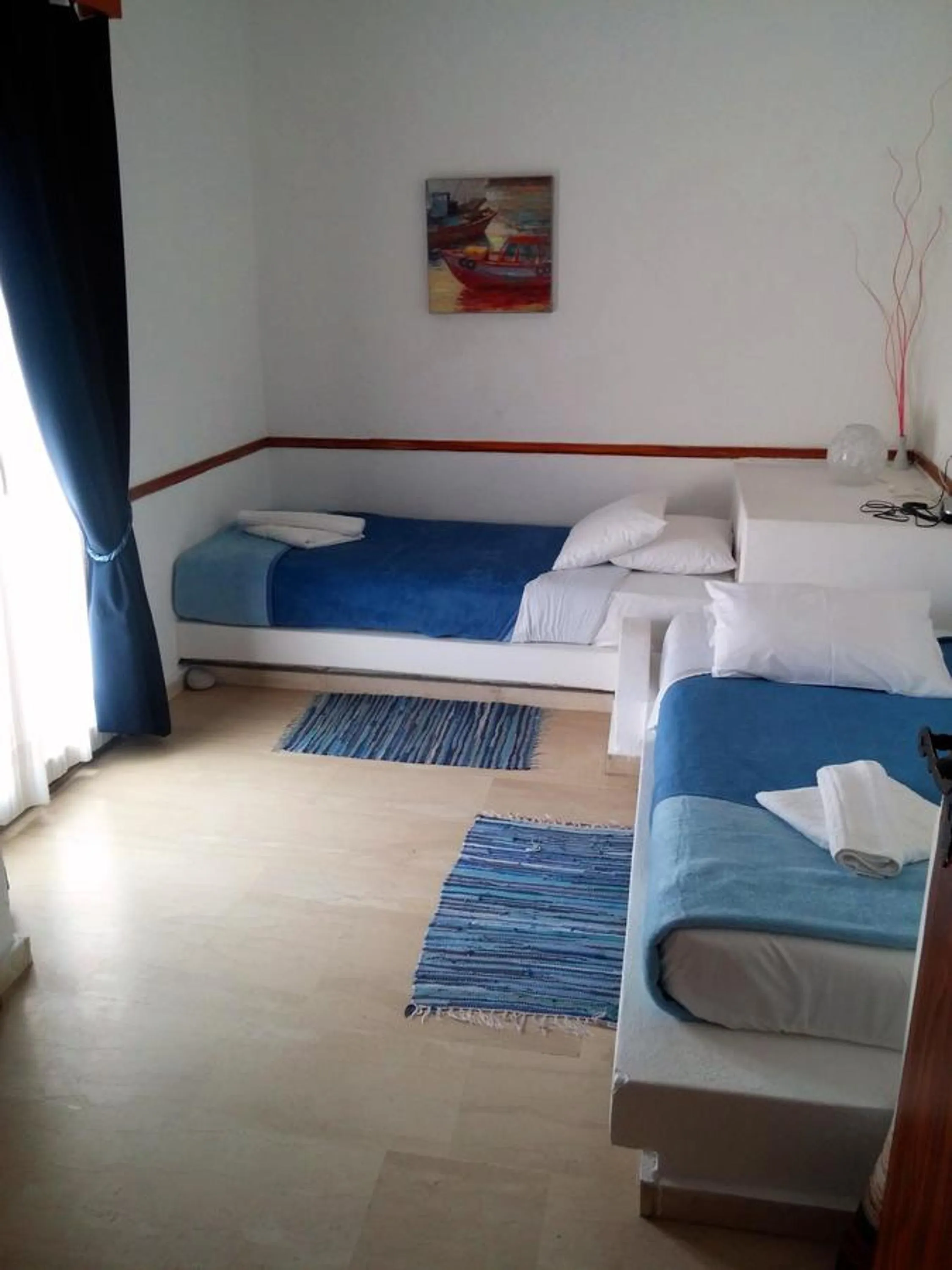 Bed in Mantraki Hotel Apartments