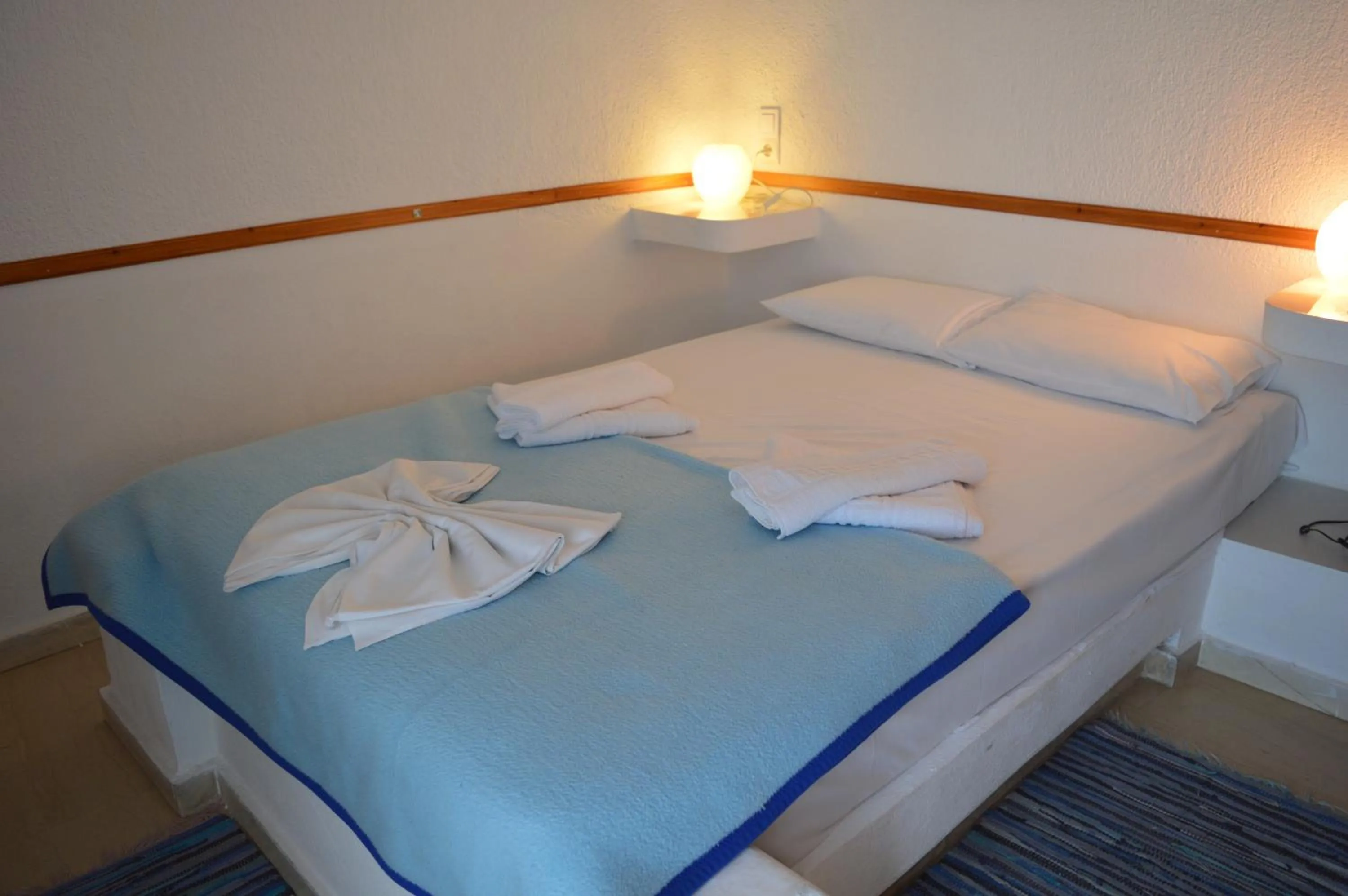 Bed in Mantraki Hotel Apartments