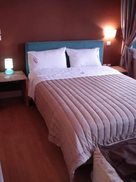 Bed in il Palazzo Rooms & Suites