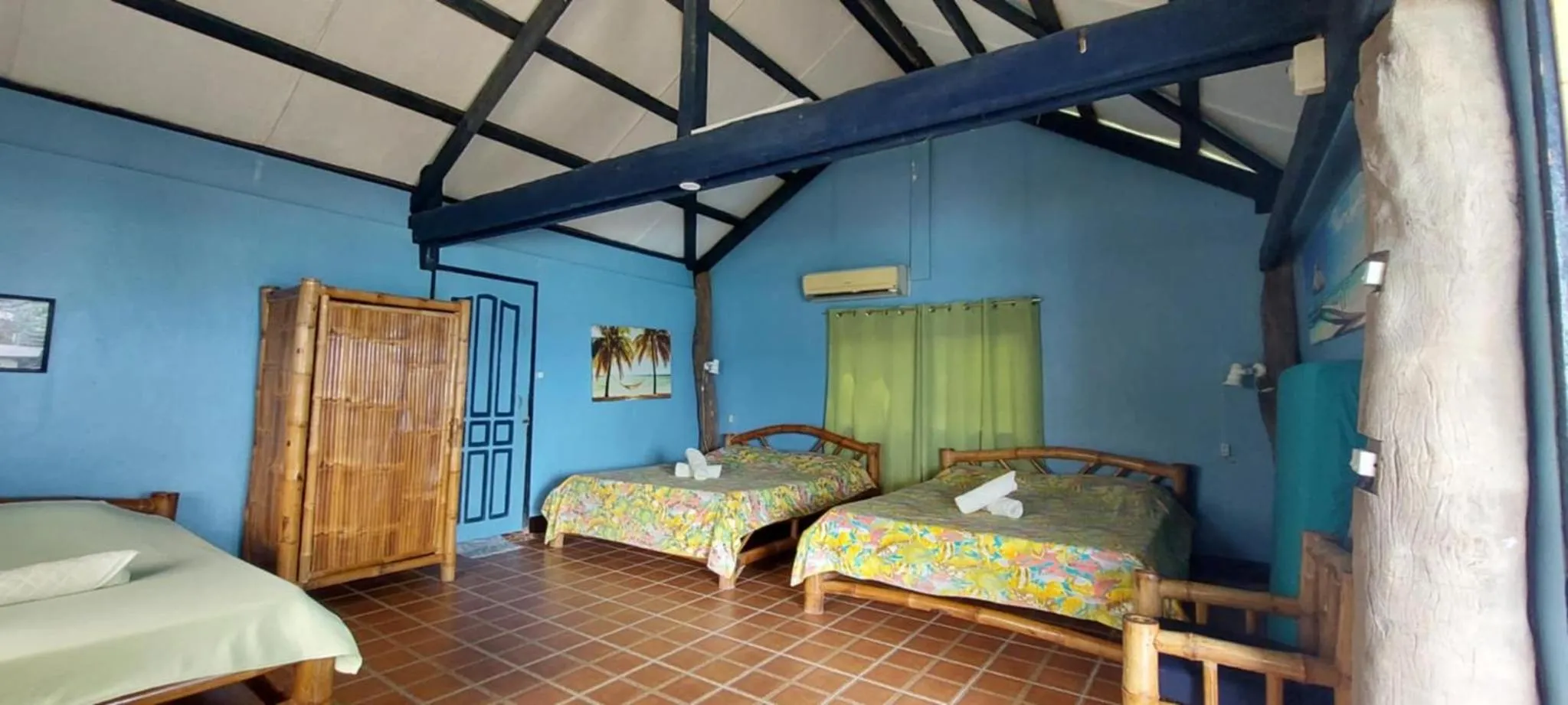Bed in Ravenala Beach Bungalows
