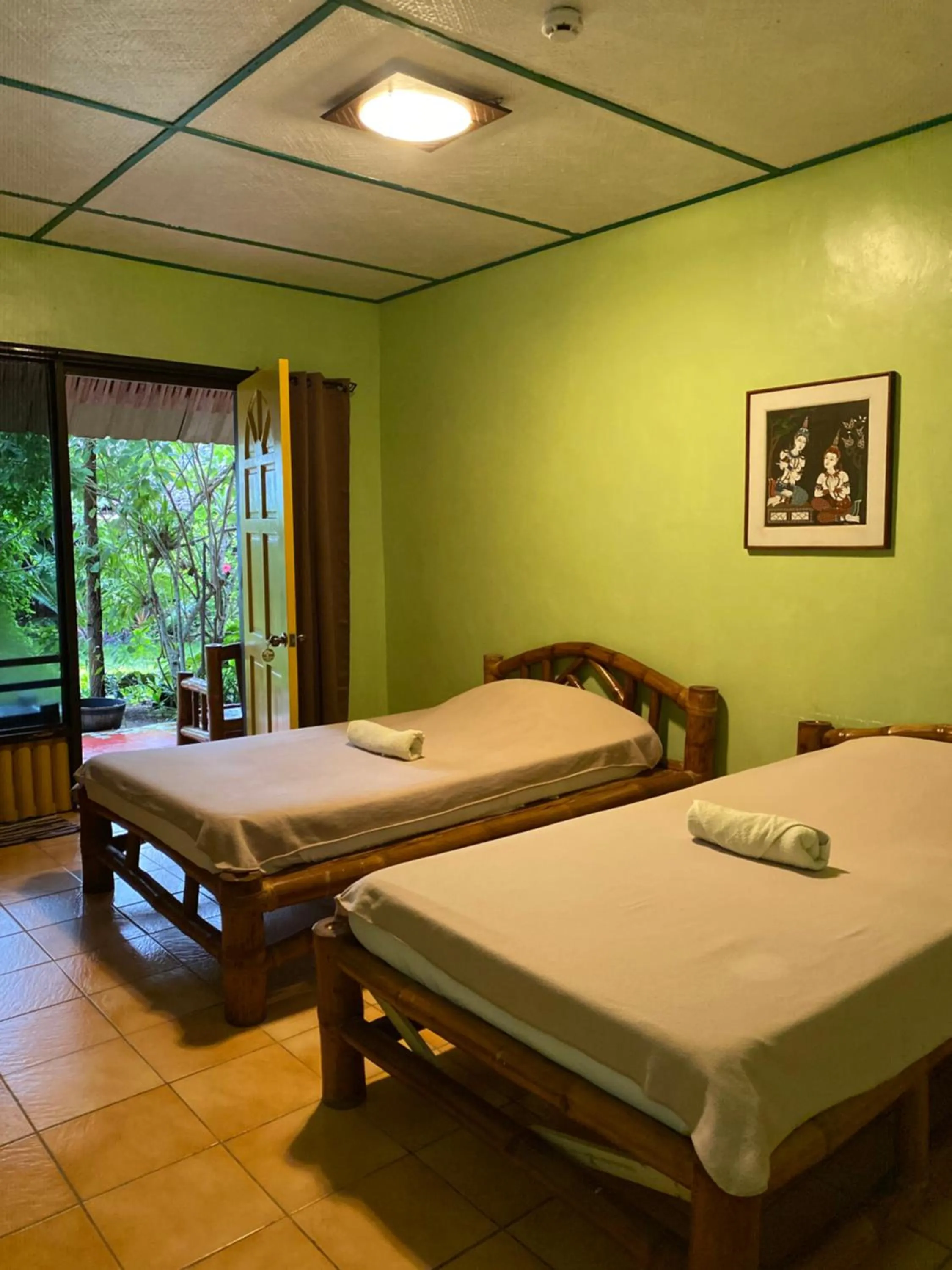 Bed in Ravenala Beach Bungalows