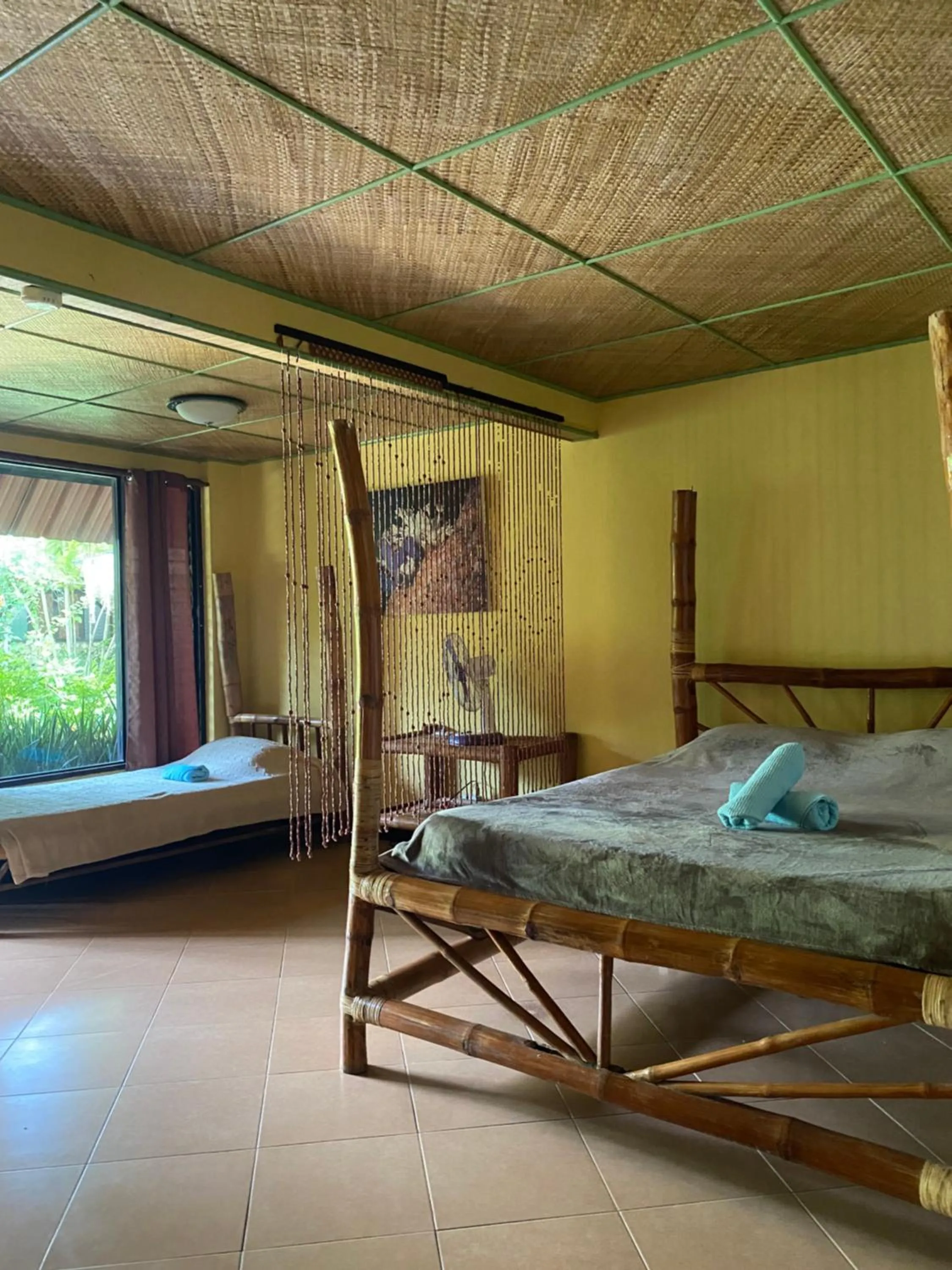 Bed in Ravenala Beach Bungalows