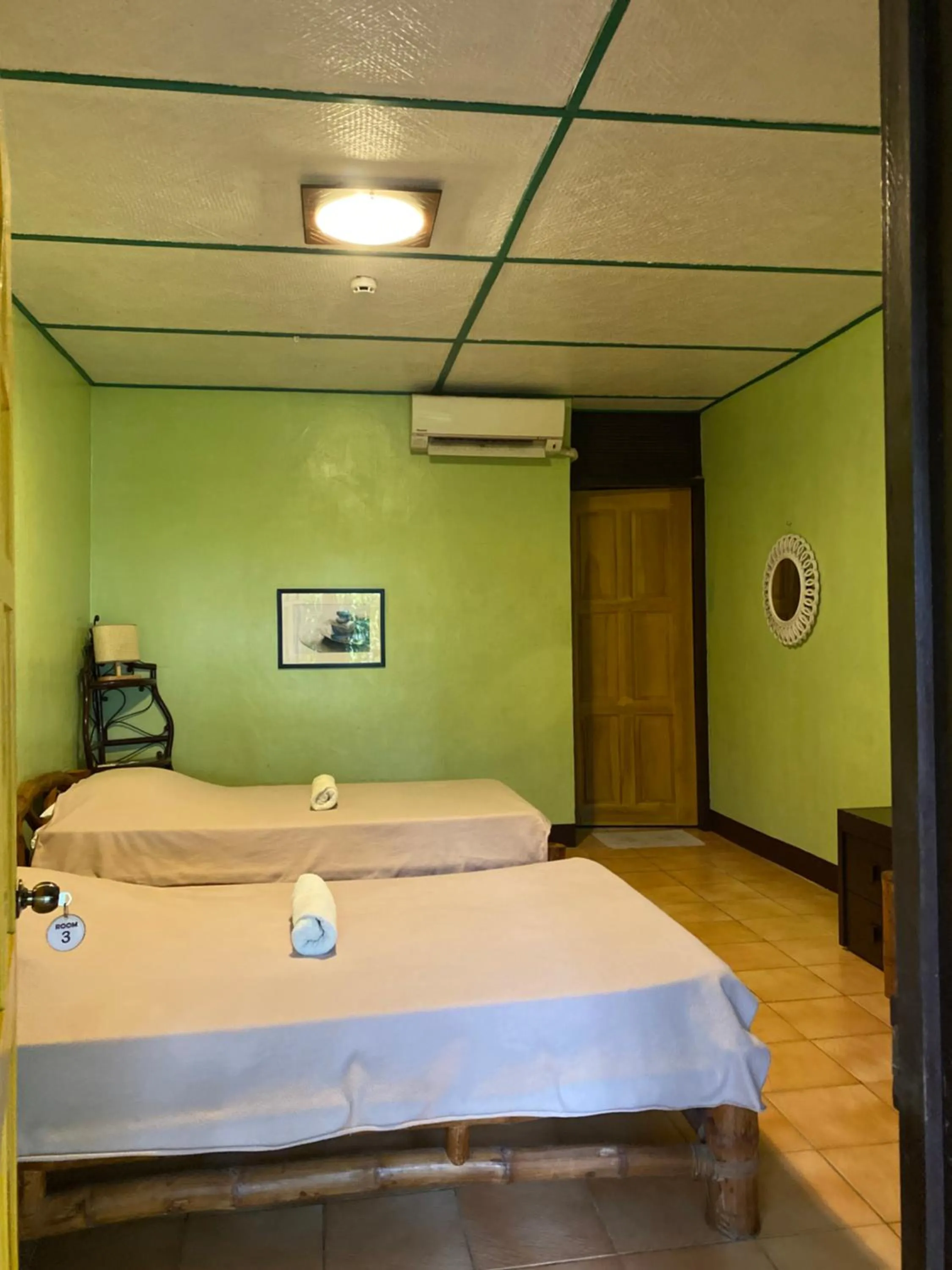 Bed in Ravenala Beach Bungalows