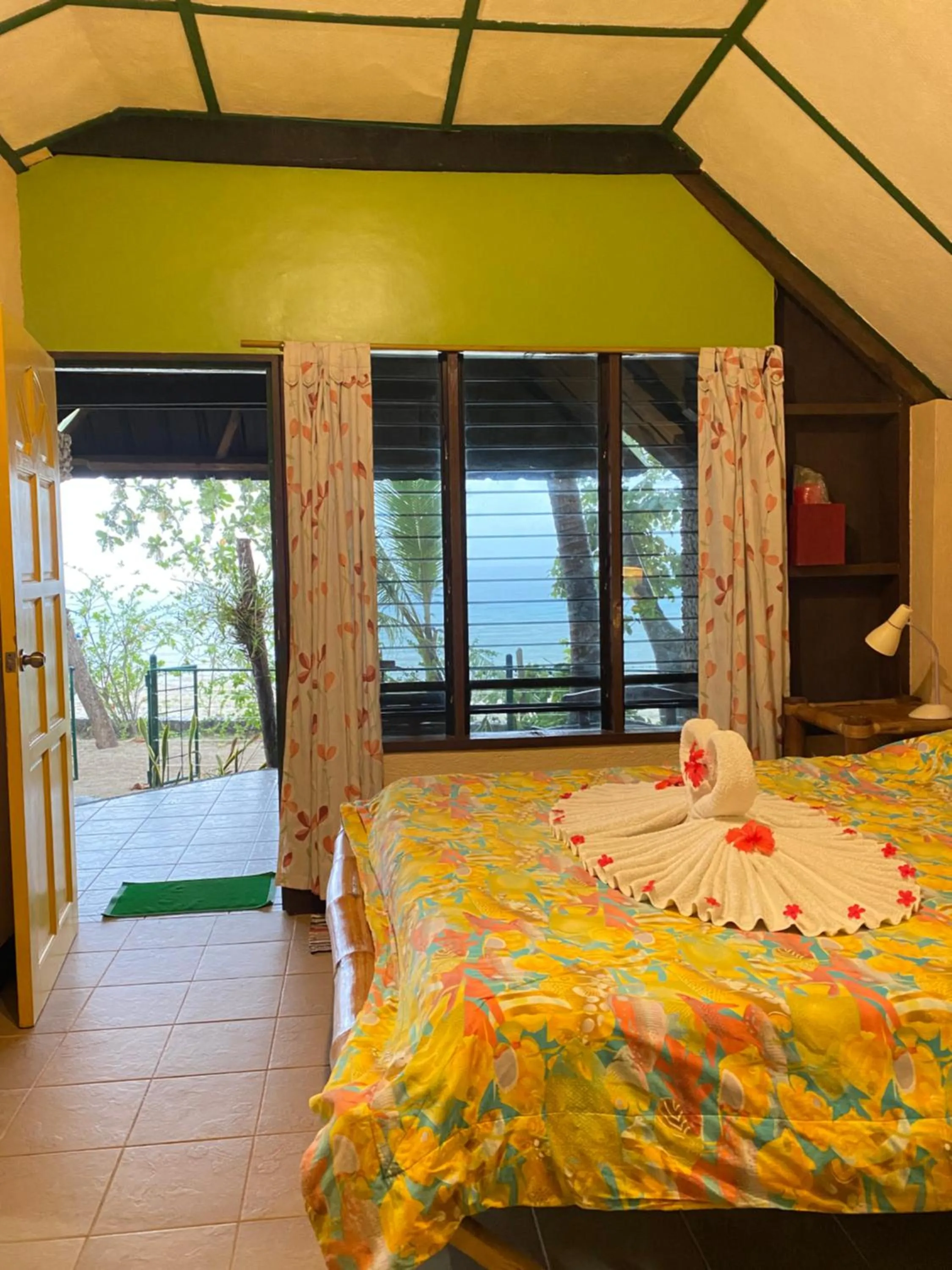 Bed in Ravenala Beach Bungalows