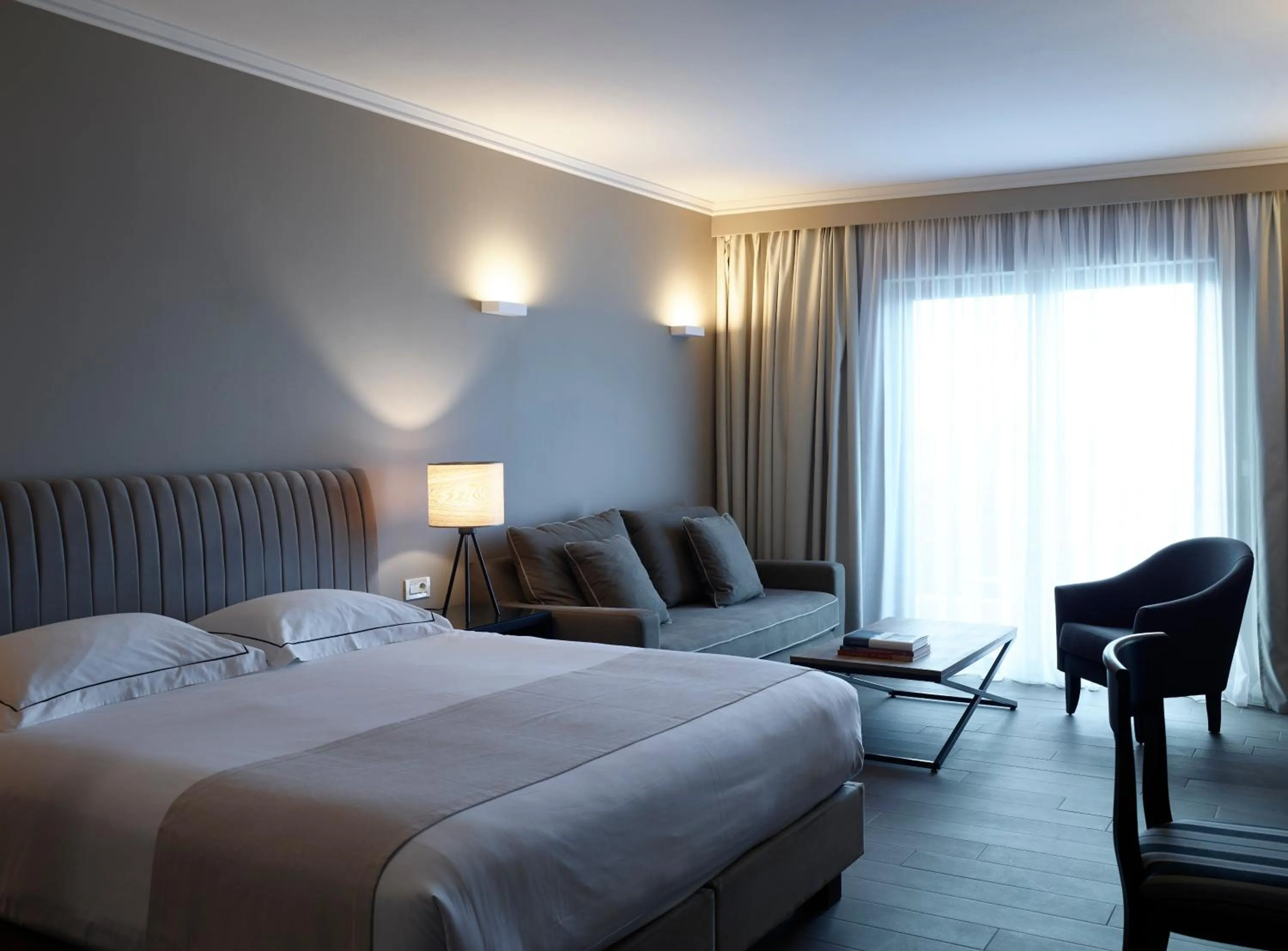 Photo of the whole room, Bed in Pelagos Suites Hotel & Spa