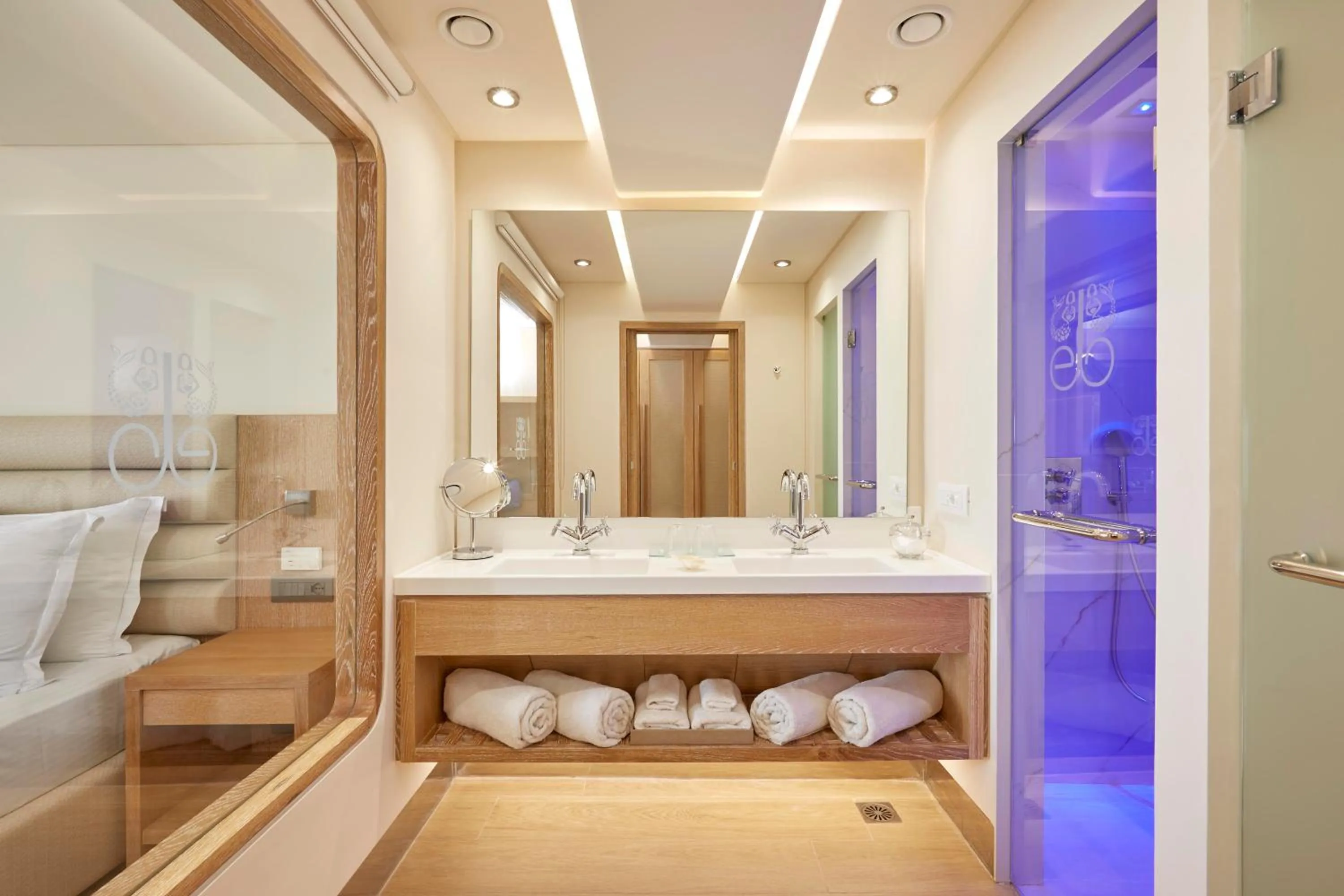 Bathroom, Bed in Elounda Bay Palace, a Member of the Leading Hotels of the World