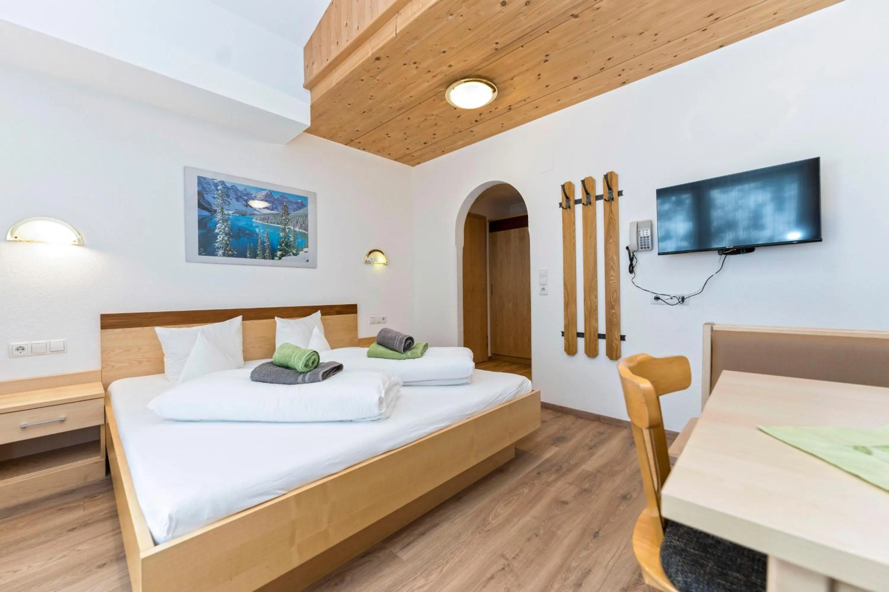 Photo of the whole room, Bed in Hotel Garni Siegele - inklusive Silvretta-Card PREMIUM