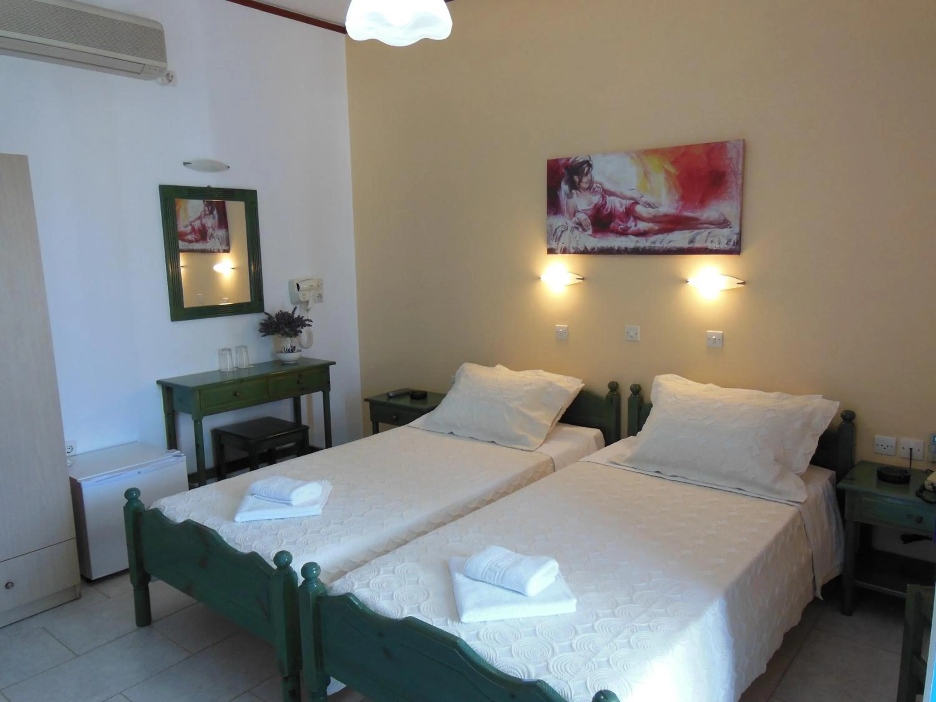 Bed in Poseidon Hotel