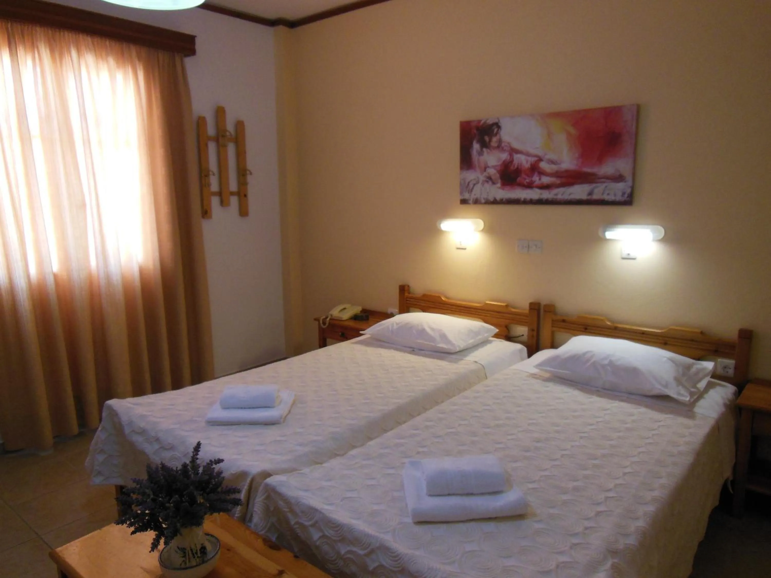 Bed in Poseidon Hotel