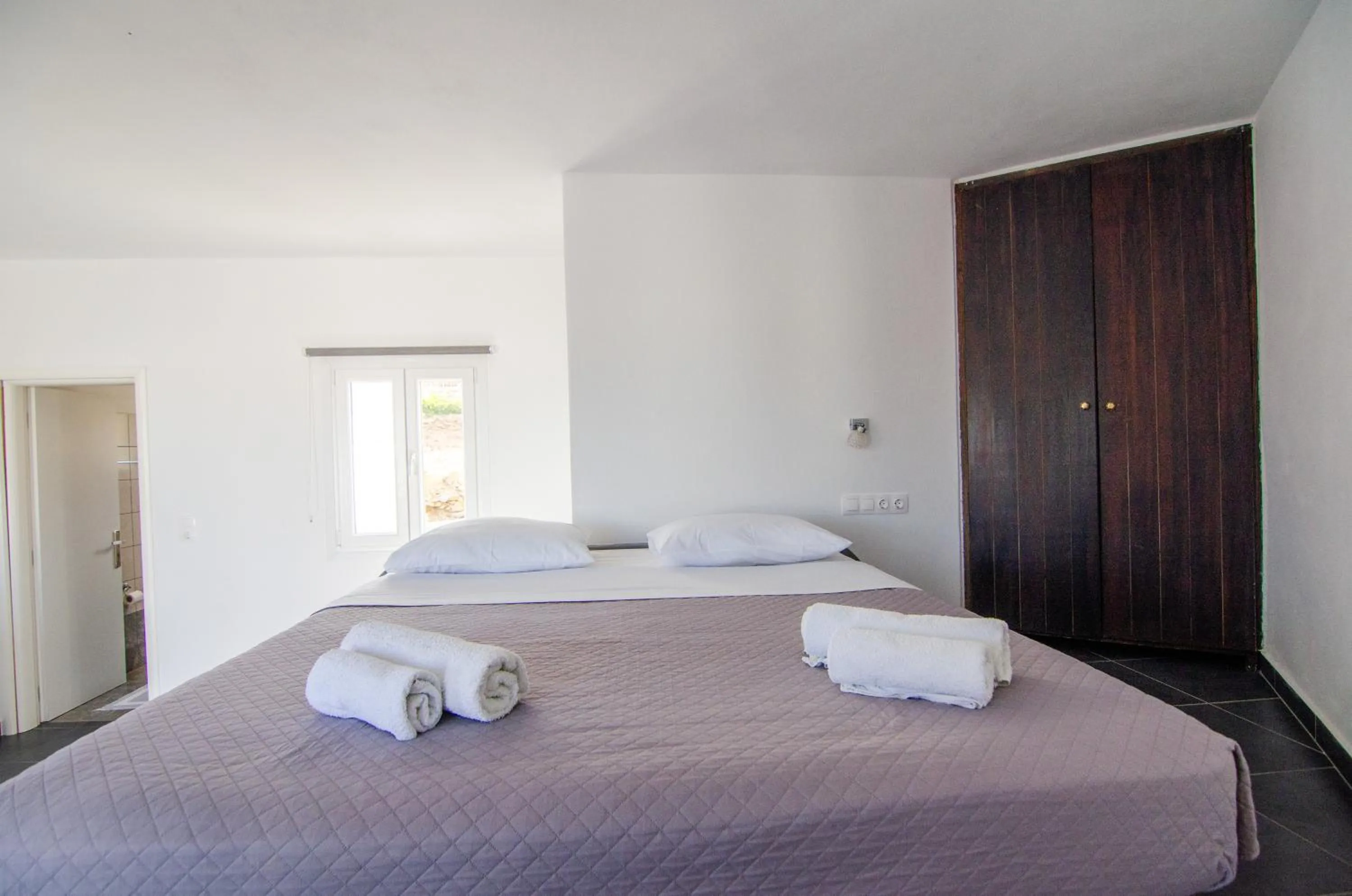 Bed in Skala Sunset Hotel and spa