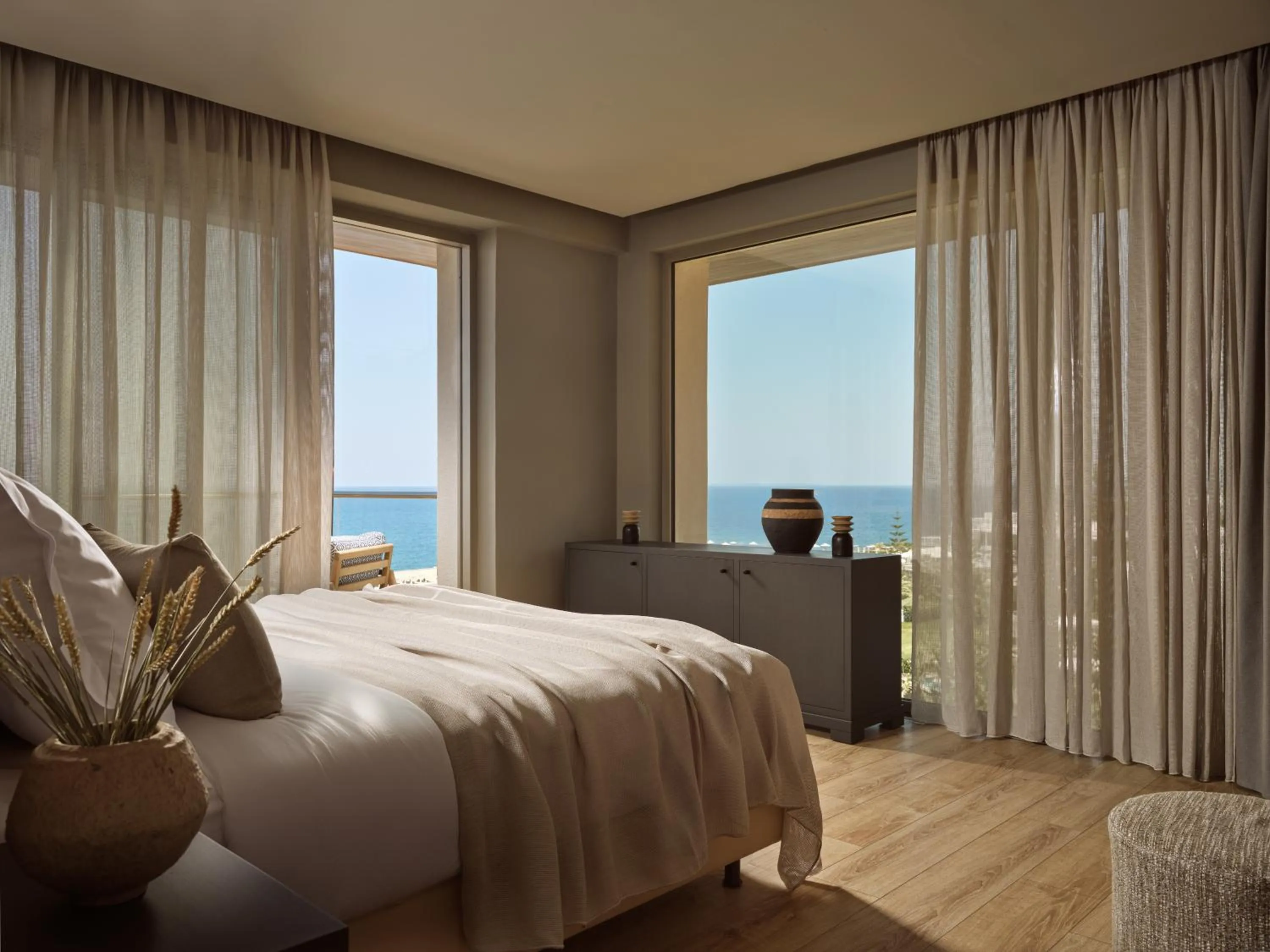 Bed in The Royal Blue a Luxury Beach Resort