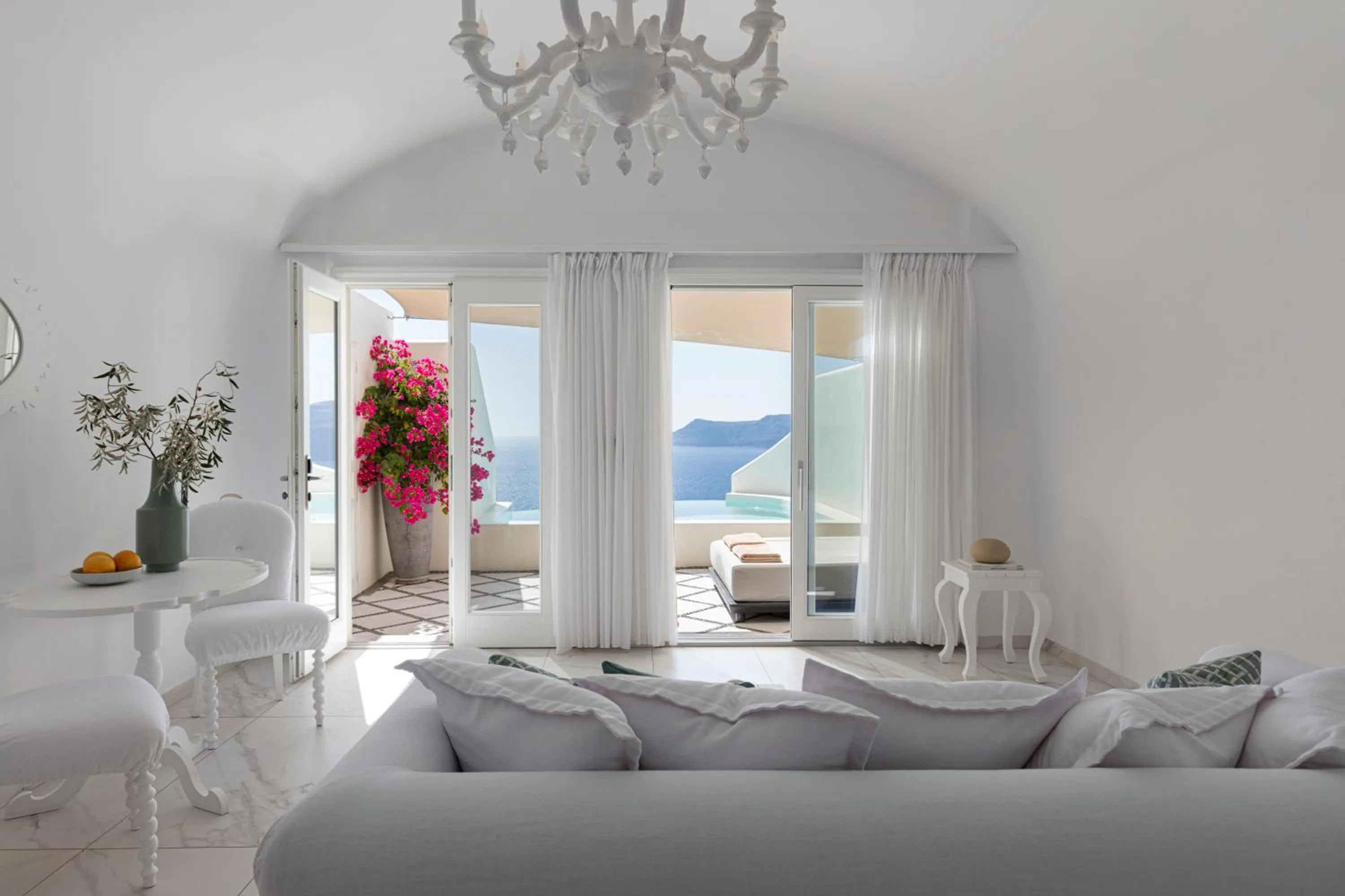Seating area, Bed in Canaves Oia Suites - Small Luxury Hotels of the World