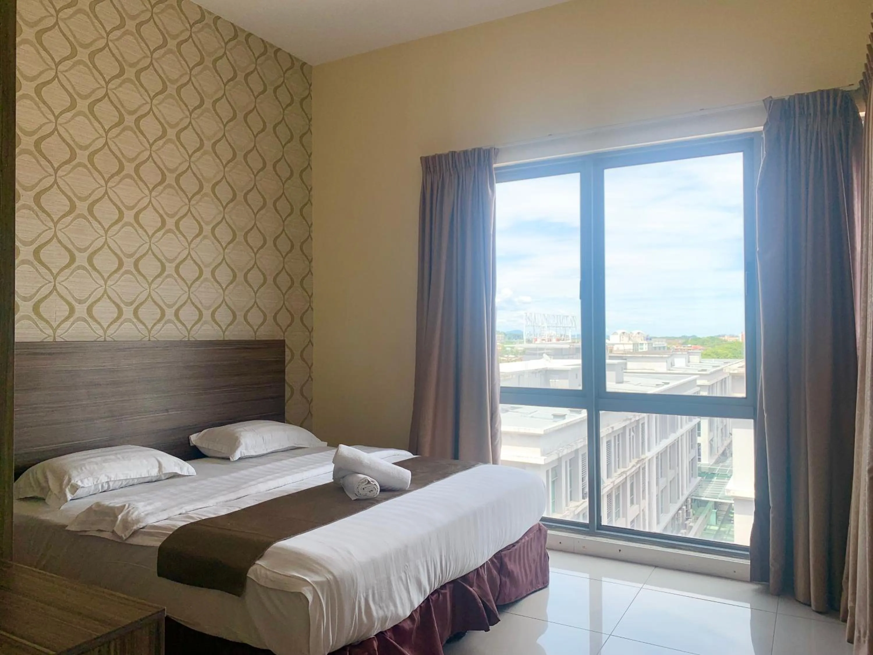 Bed in Sunset Seaview Vacation Condos @ IMAGO Shopping Mall