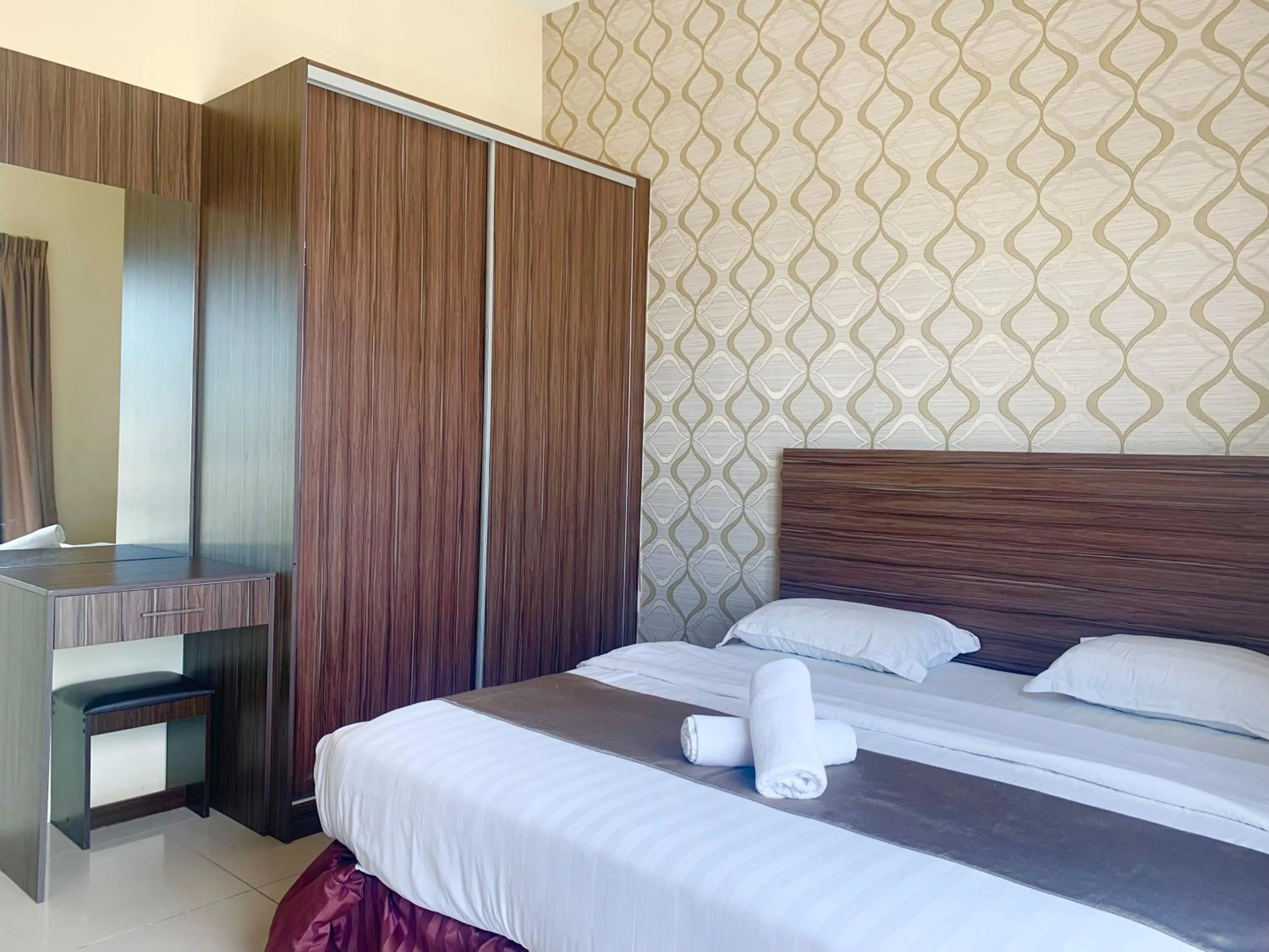 Bed in Sunset Seaview Vacation Condos @ IMAGO Shopping Mall