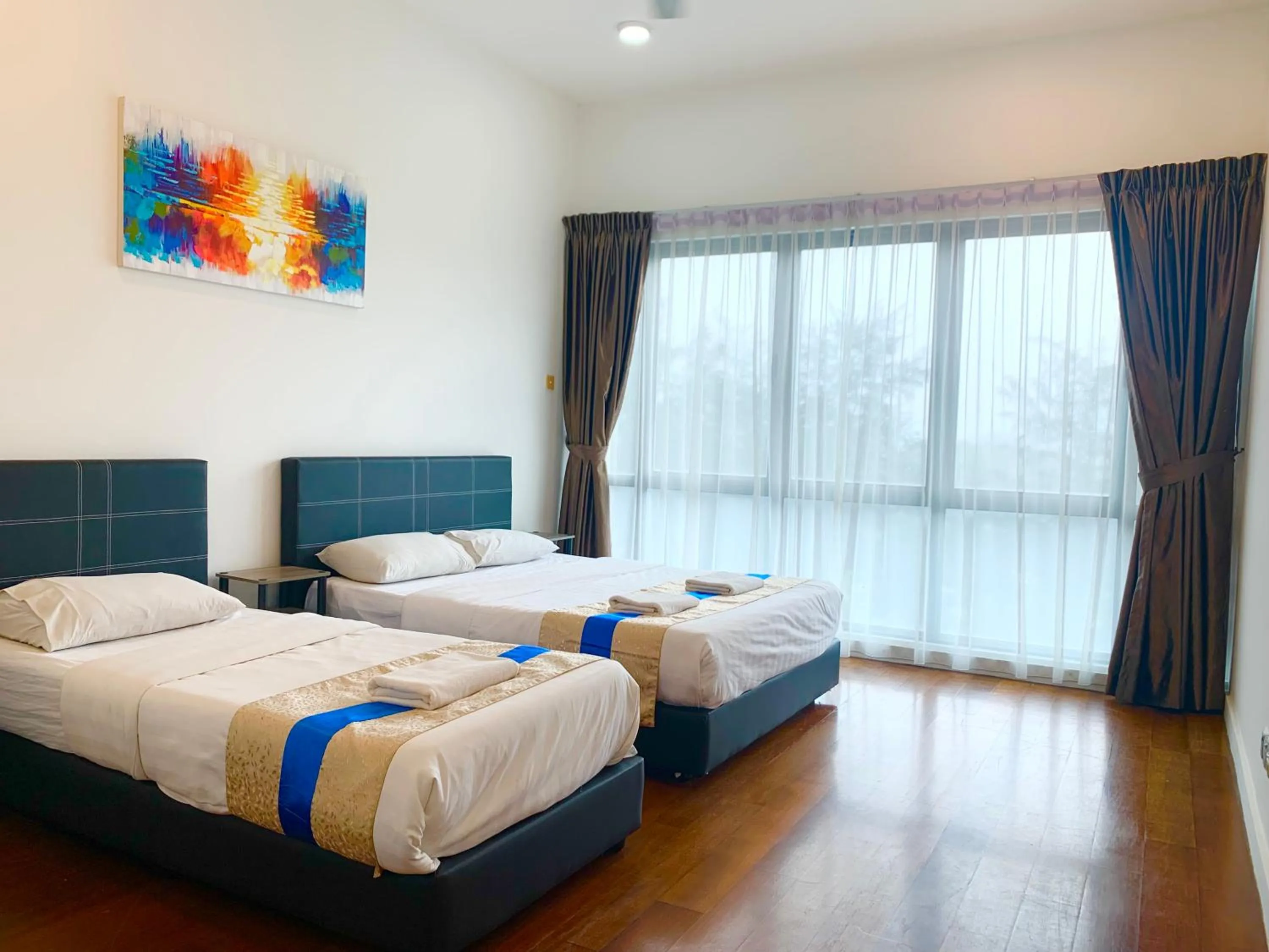 Bed in Sunset Seaview Vacation Condos @ IMAGO Shopping Mall