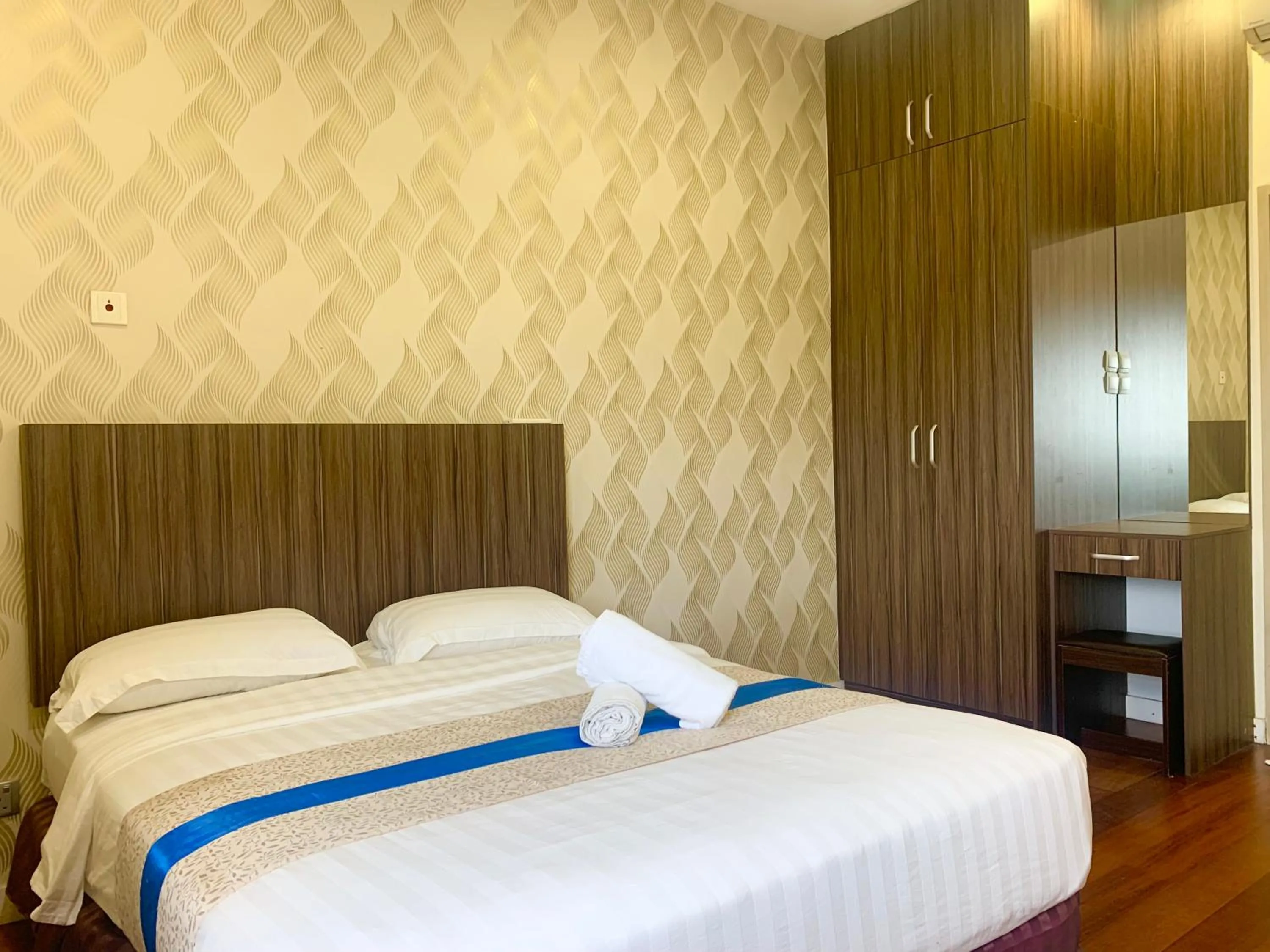 Bed in Sunset Seaview Vacation Condos @ IMAGO Shopping Mall