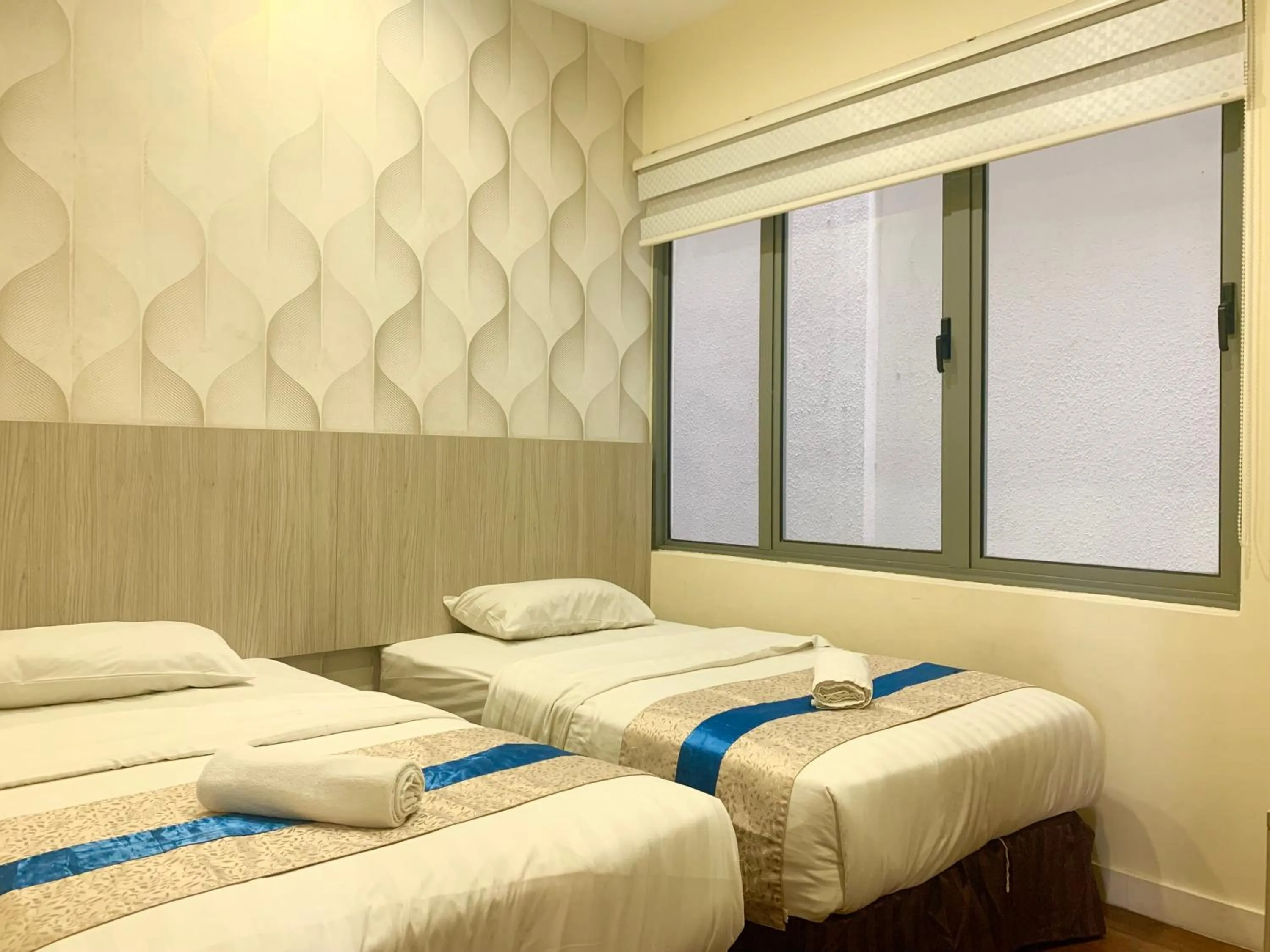 Bed in Sunset Seaview Vacation Condos @ IMAGO Shopping Mall