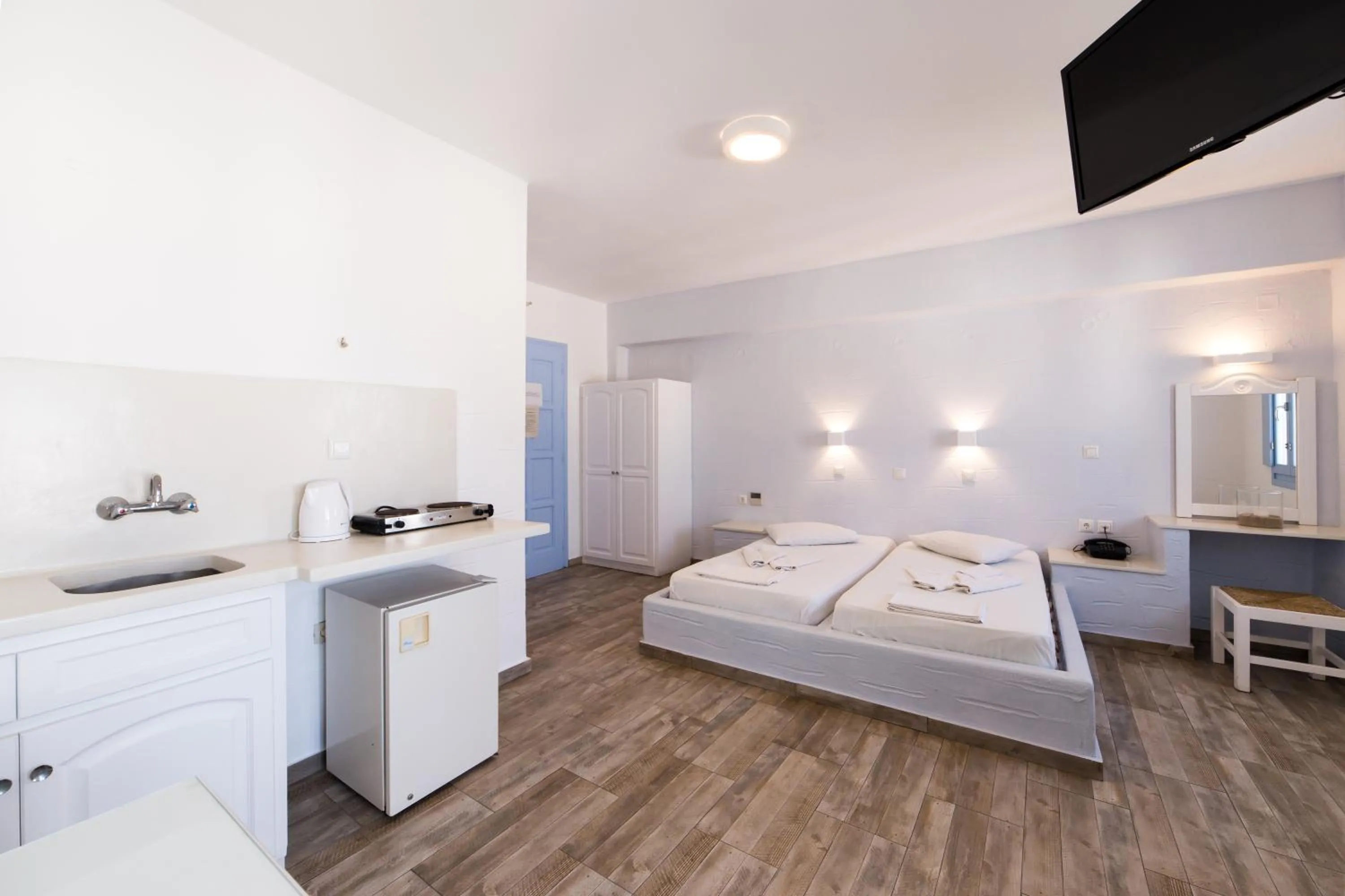 Bed in Stratos Apartments & Studios
