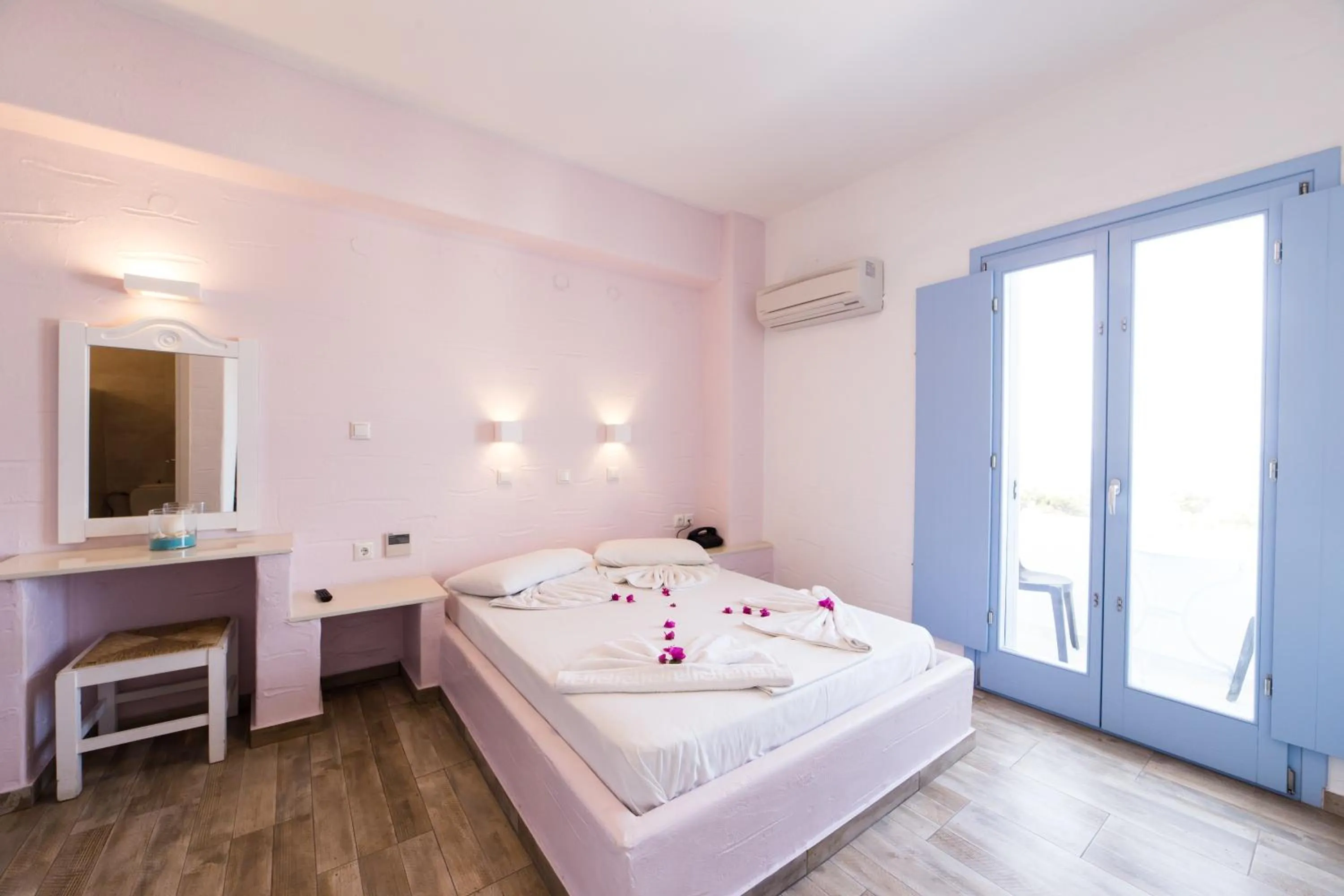 Bed in Stratos Apartments & Studios