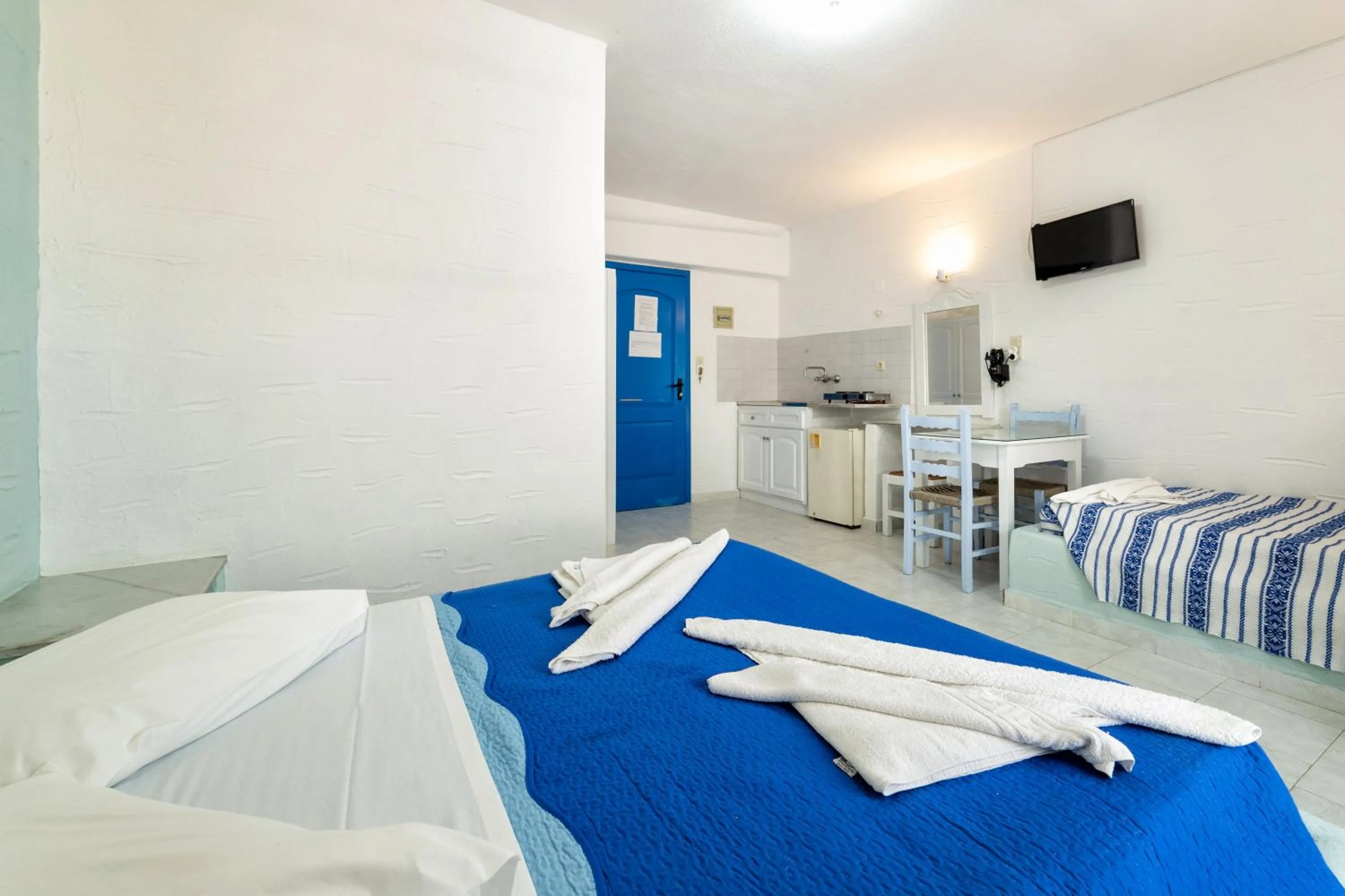 Bed in Stratos Apartments & Studios