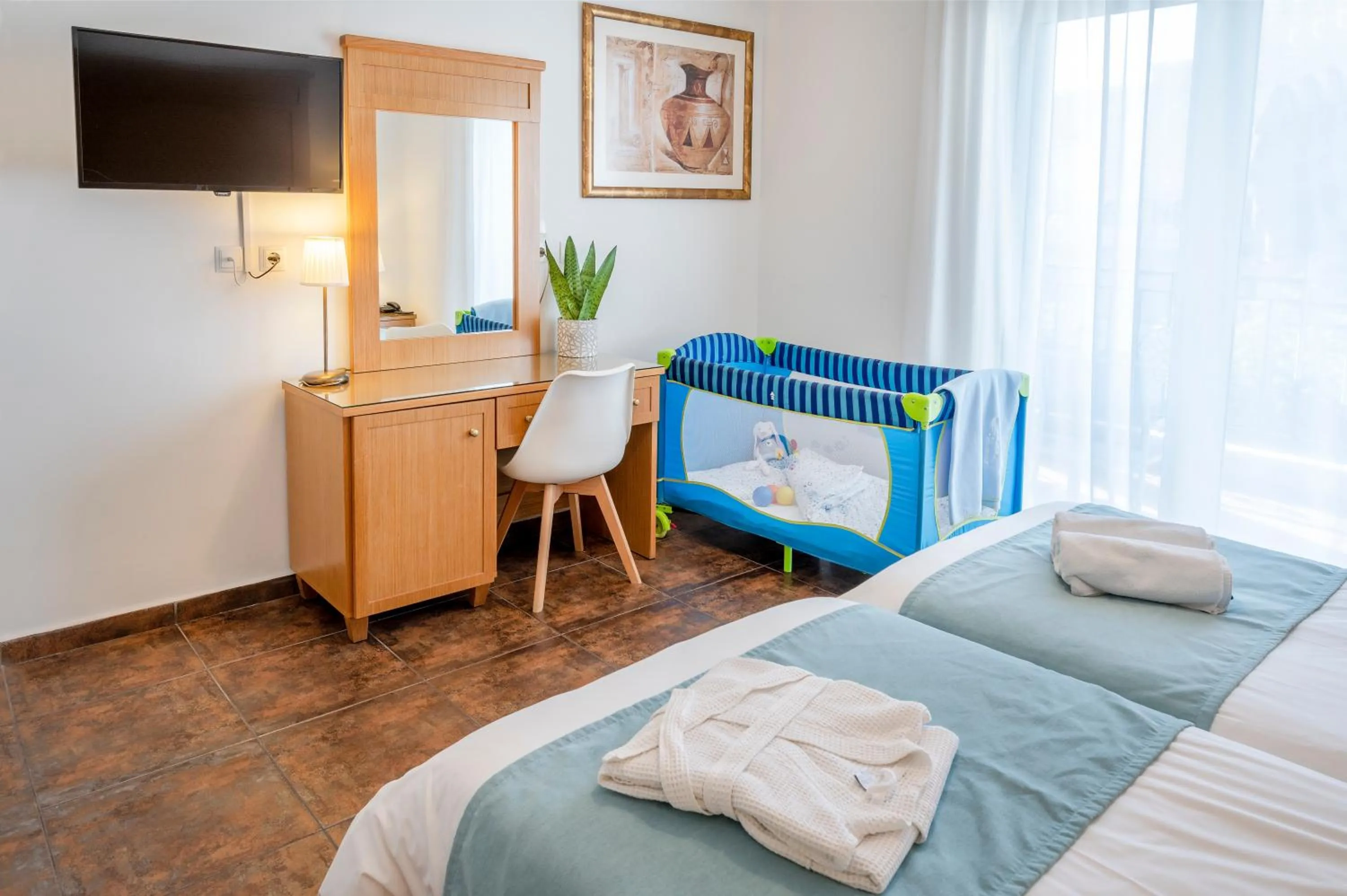 Bed in Peridis Family Resort