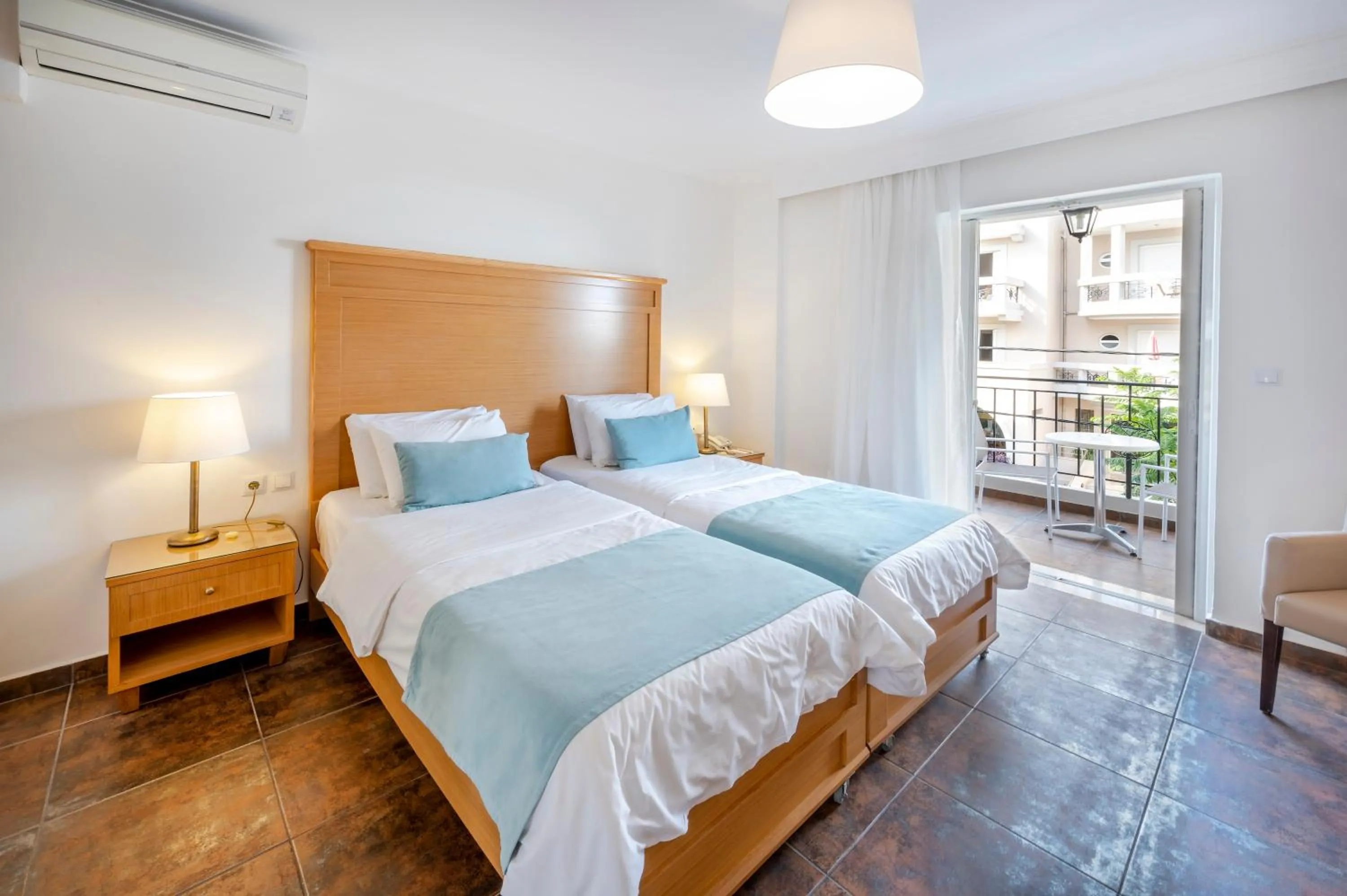 Bed in Peridis Family Resort