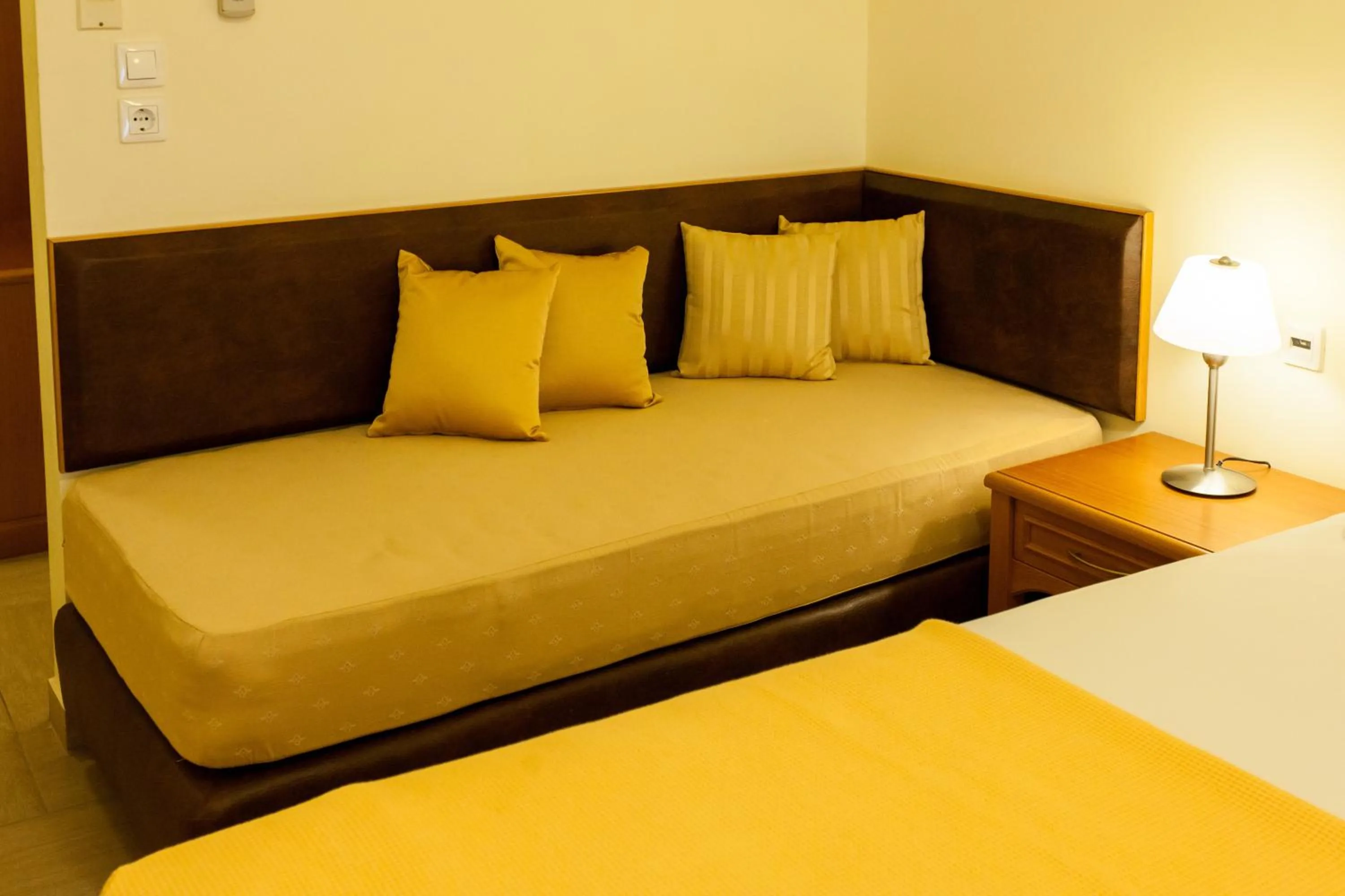 Seating area, Bed in Pantheon City Hotel